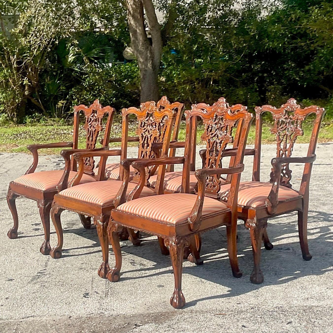A fabulous set of six vintage Dining chairs. Hand carved detail on the classic Chippendale shape. Cabriolet legs with the iconic ball and claw foot. Acquired from a Palm Beach estate.