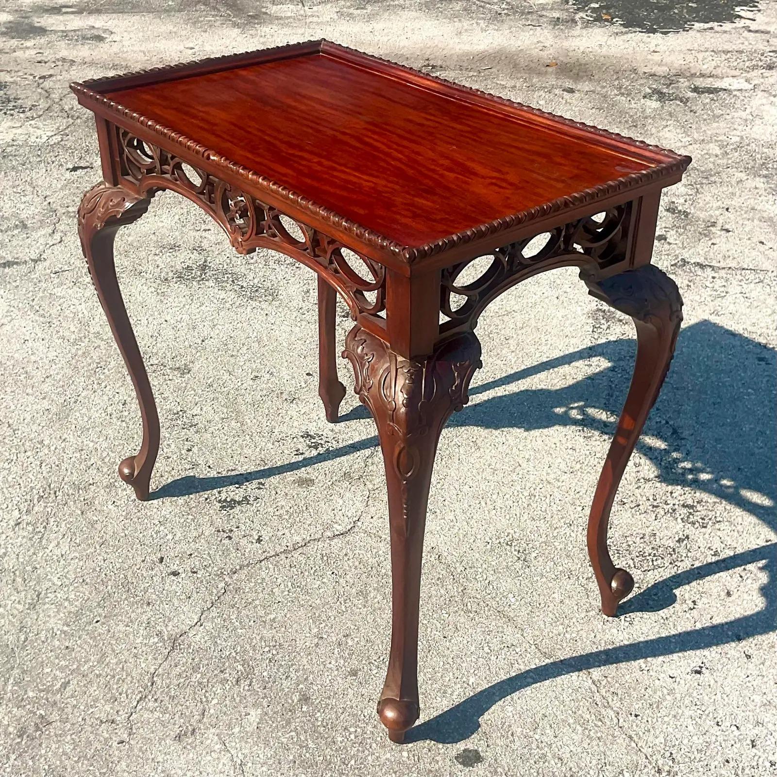 A fantastic vintage Regency Tea table. Beautiful hand carved Cabriolet legs with open fretwork detail abound the apron. Acquired from a Palm Beach estate.