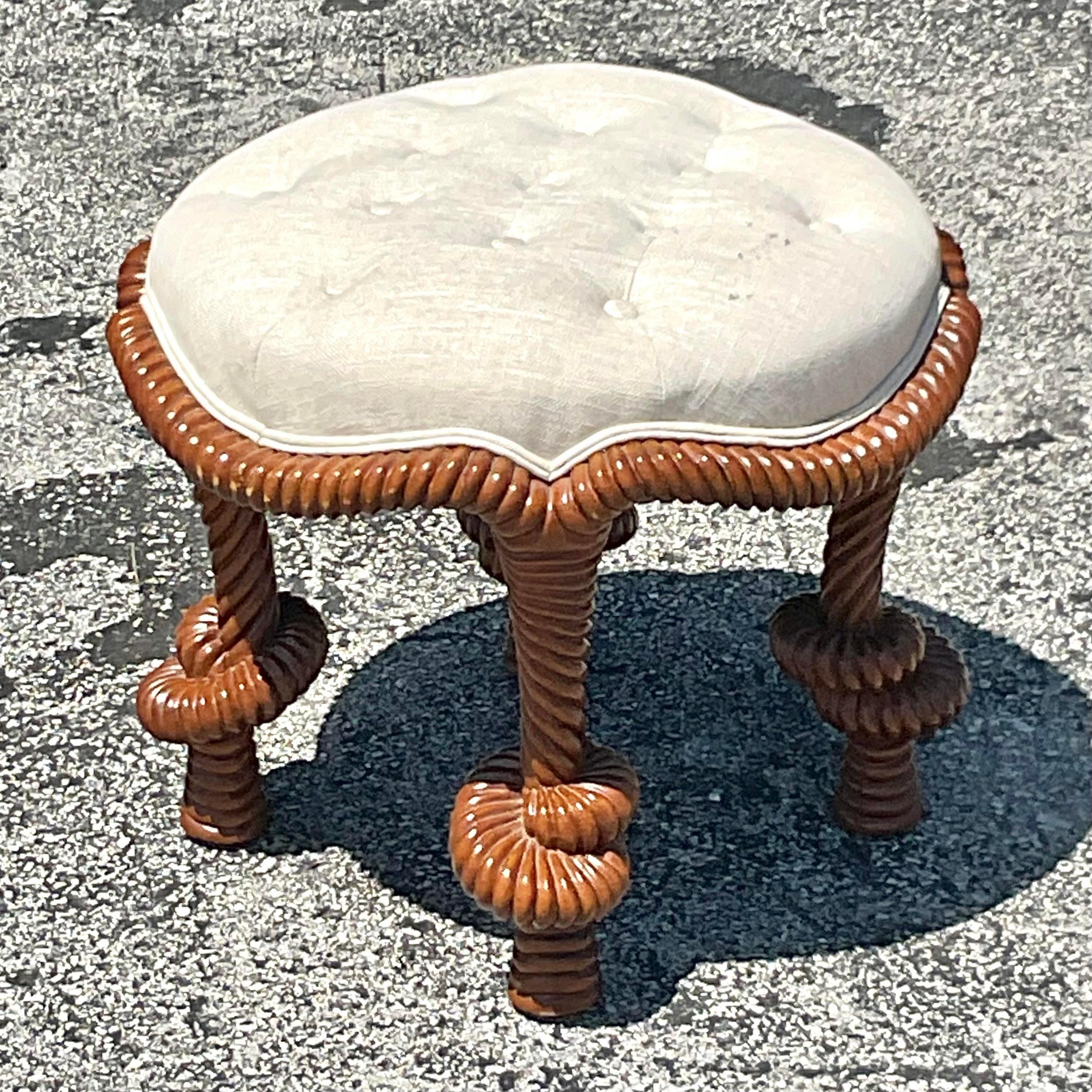 Experience elegance with our Vintage Regency Carved Knot Tufted Low Stool. This American-style treasure showcases intricate carving and plush tufted upholstery, adding a touch of sophistication to any room