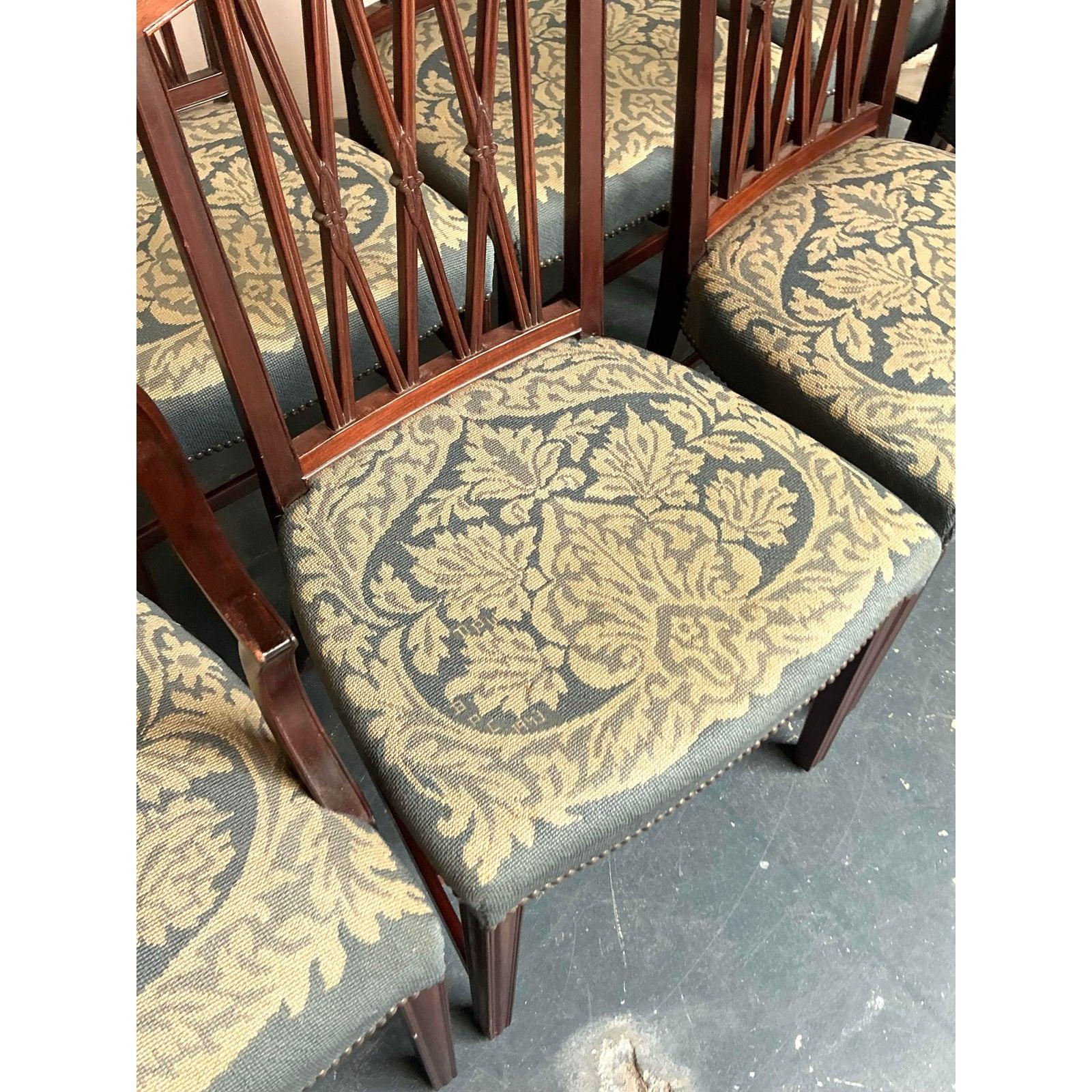 Presenting a superb set of eight Vintage Regency Carved Mahogany Trellis Dining Chairs, a collection that marries classic elegance with exceptional craftsmanship. These chairs are a quintessential example of Regency design, featuring intricately