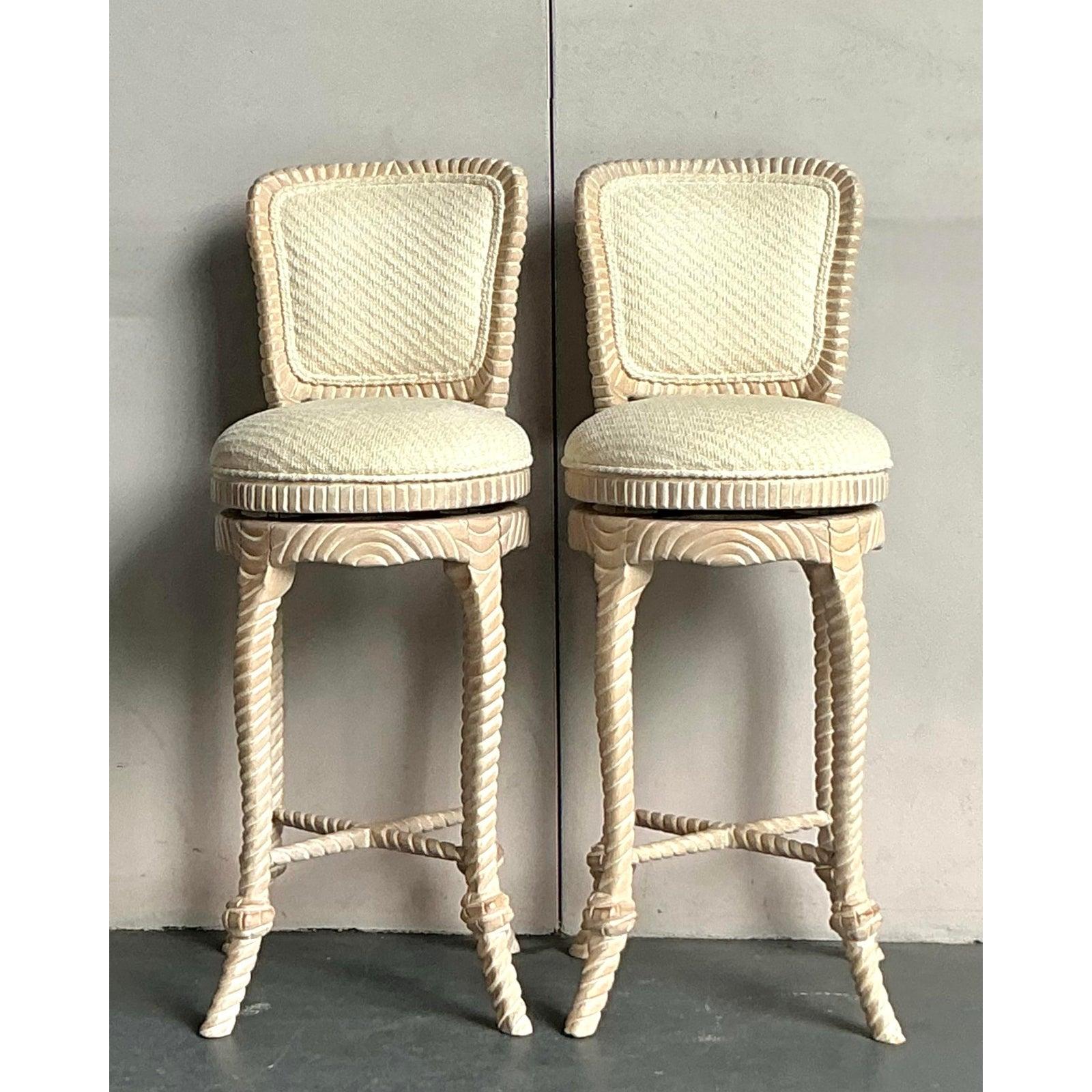 Discover this exquisite pair of vintage barstools, embodying the sophisticated charm of the Hollywood Regency era with a unique twist. Each stool is meticulously carved with a captivating rope-twist motif on its legs and frame, showcasing