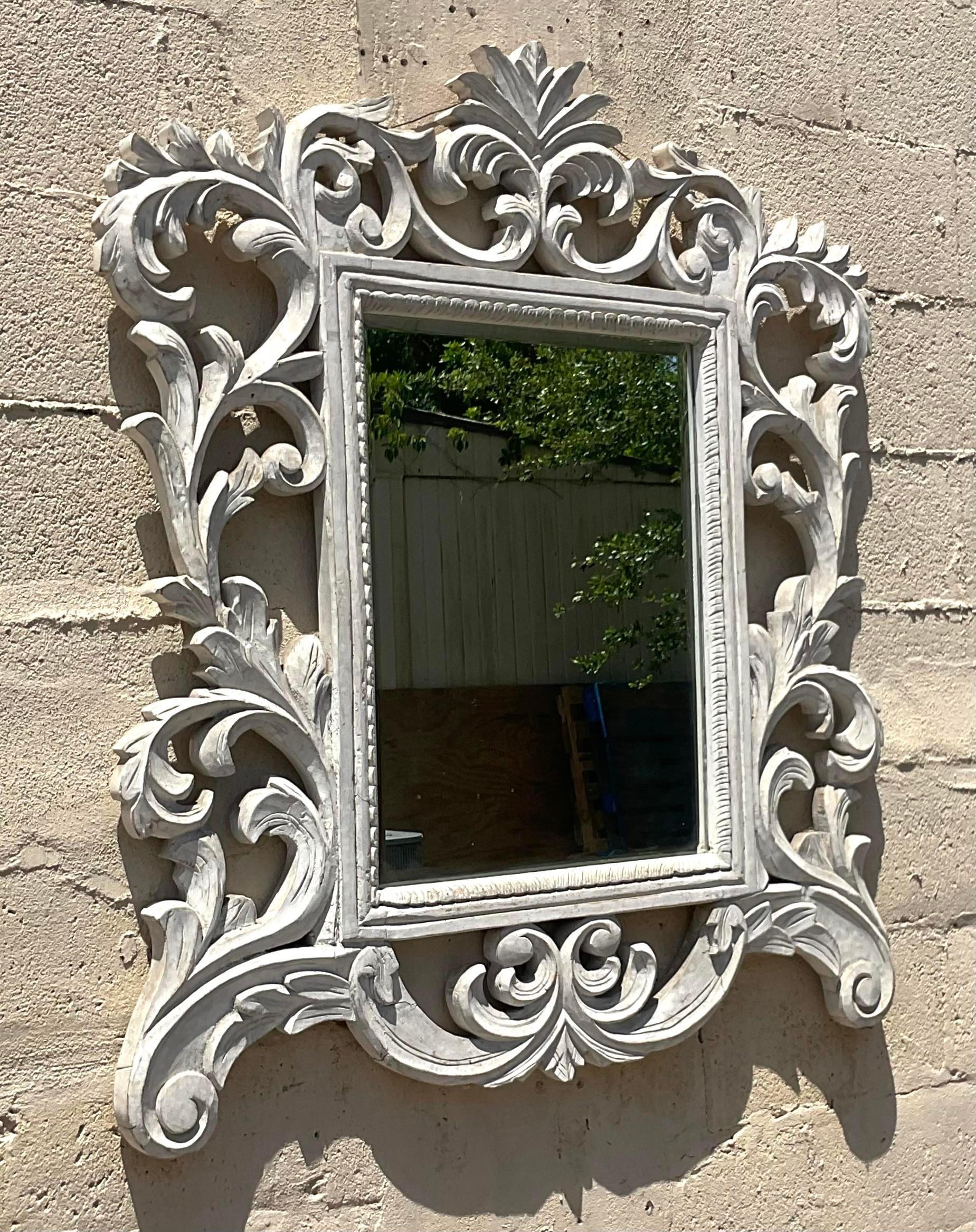 Step into timeless elegance with our Vintage Regency Carved Scrolling Vine Mirror. American-crafted, this mirror features intricate scrolling vine motifs, blending classic Regency style with artistic craftsmanship for a sophisticated and luxurious