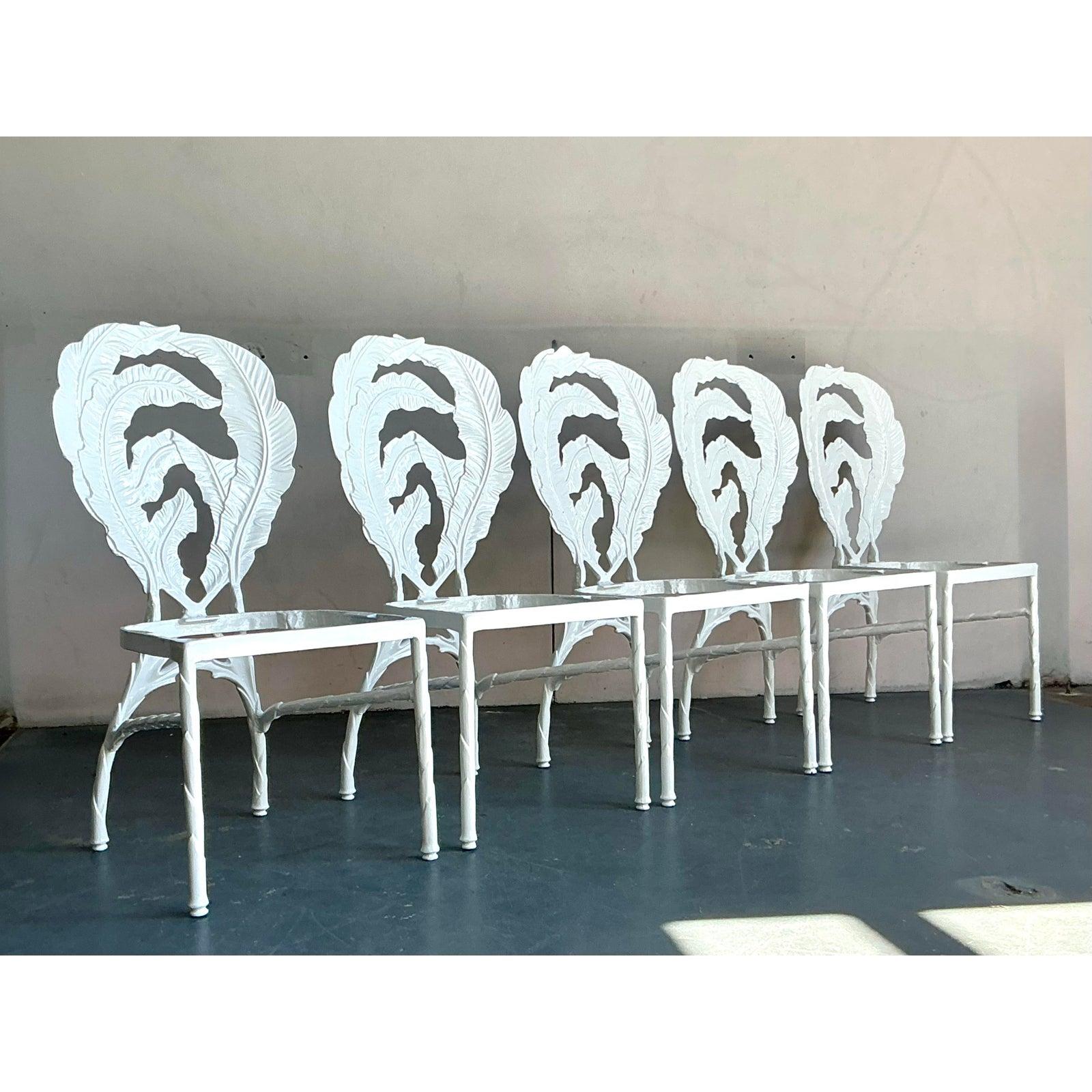 Elevate your dining or patio space with this exceptional set of five vintage Hollywood Regency dining chairs, crafted from durable cast aluminum. Each chair boasts an intricately detailed banana leaf motif on its backrest, a signature design element