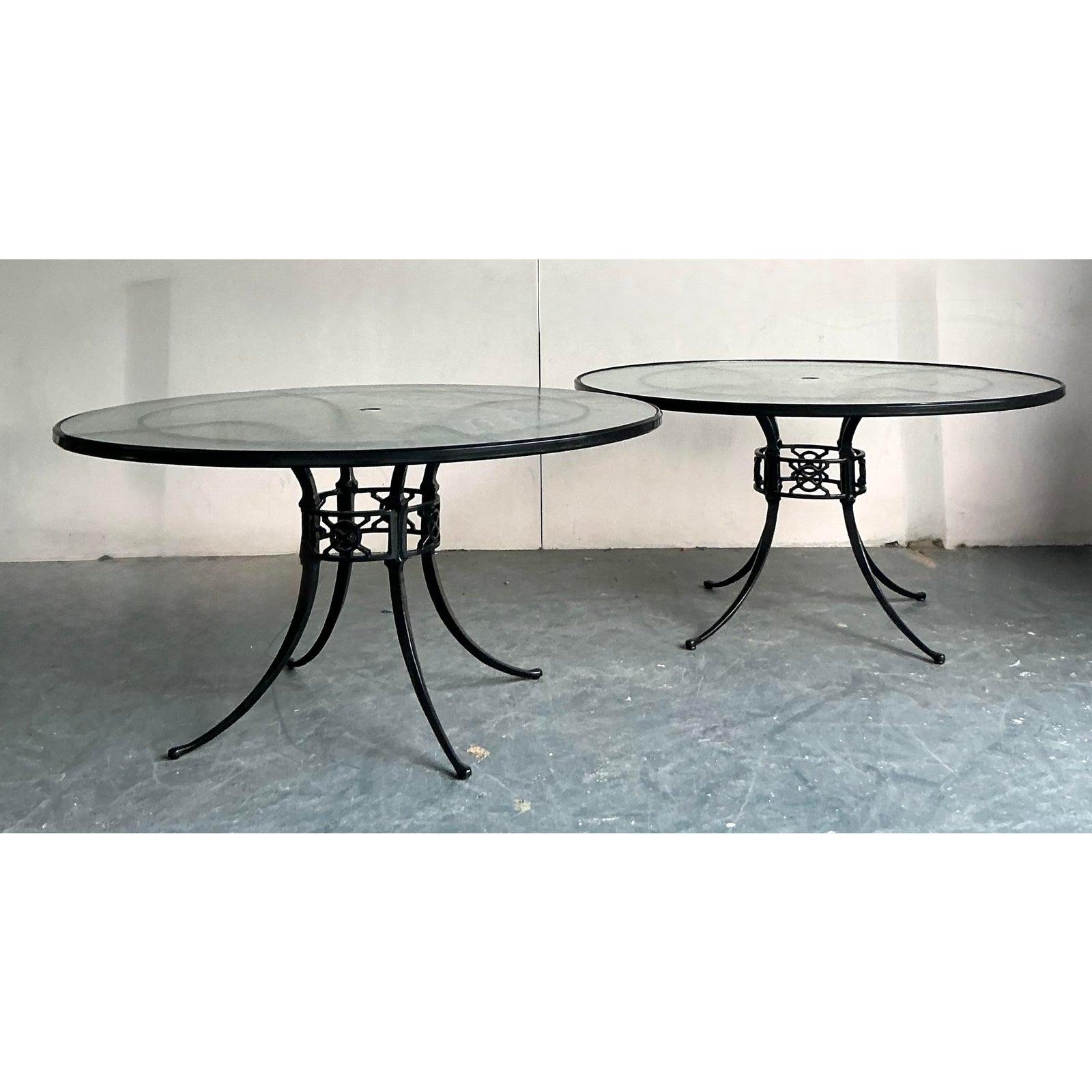 Create an atmosphere of timeless elegance for al fresco entertaining with this handsome pair of vintage outdoor dining tables. Crafted from durable cast aluminum with a classic black finish, each table features a sculptural base with intricate