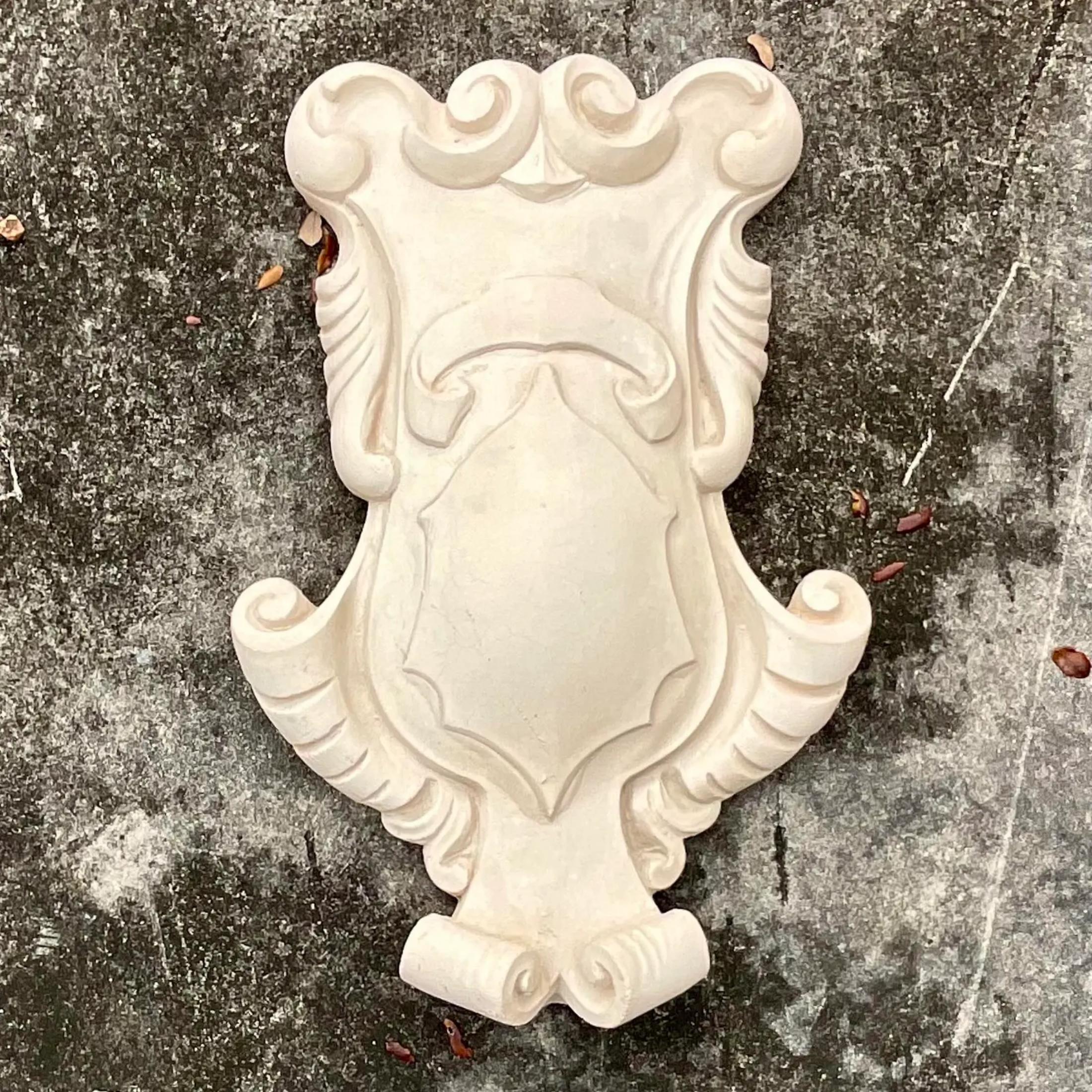 A stunning vintage cast concrete coat of arms. A fantastic addition to any garden or formal sitting room. Sure to add a flash or glamour to any space. Perfect as is or paint it white for a Dorothy Draper look. Acquired from a Palm Beach estate.