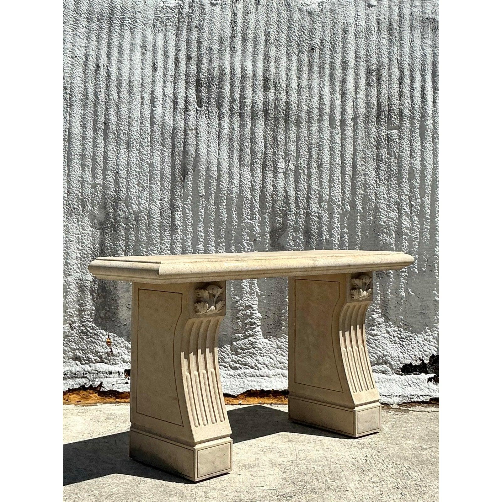 Elevate your space with this stately vintage Regency-style cast concrete console table, a timeless piece that exudes elegance and sophistication. Featuring a substantial rectangular top supported by two sculptural pedestal bases, this table is