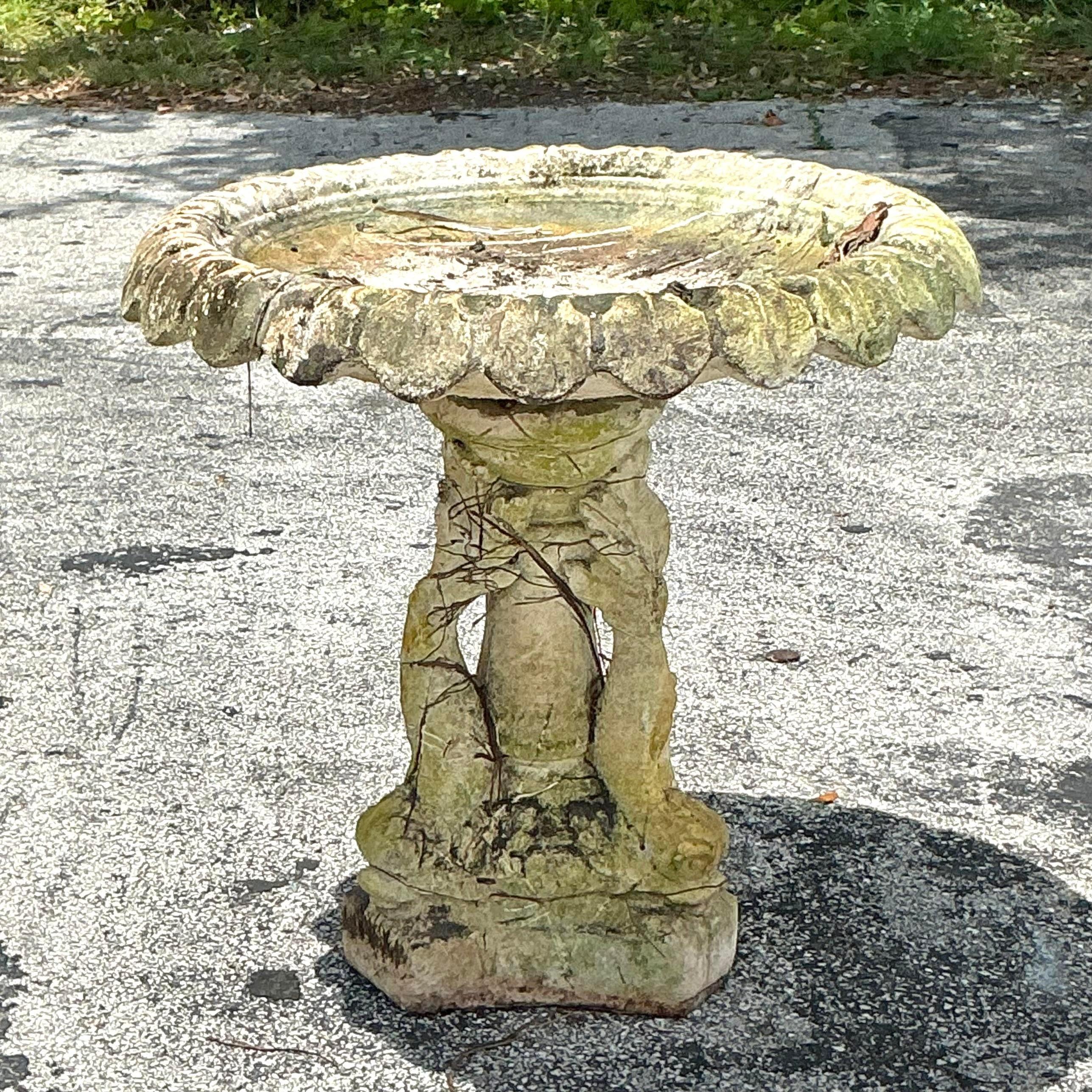Enhance your garden or patio with this Vintage Regency Cast Concrete Dolphin Birdbath. Perfect for American-style exteriors, this elegant birdbath features intricately crafted dolphins supporting a shallow basin, adding a touch of classical regency