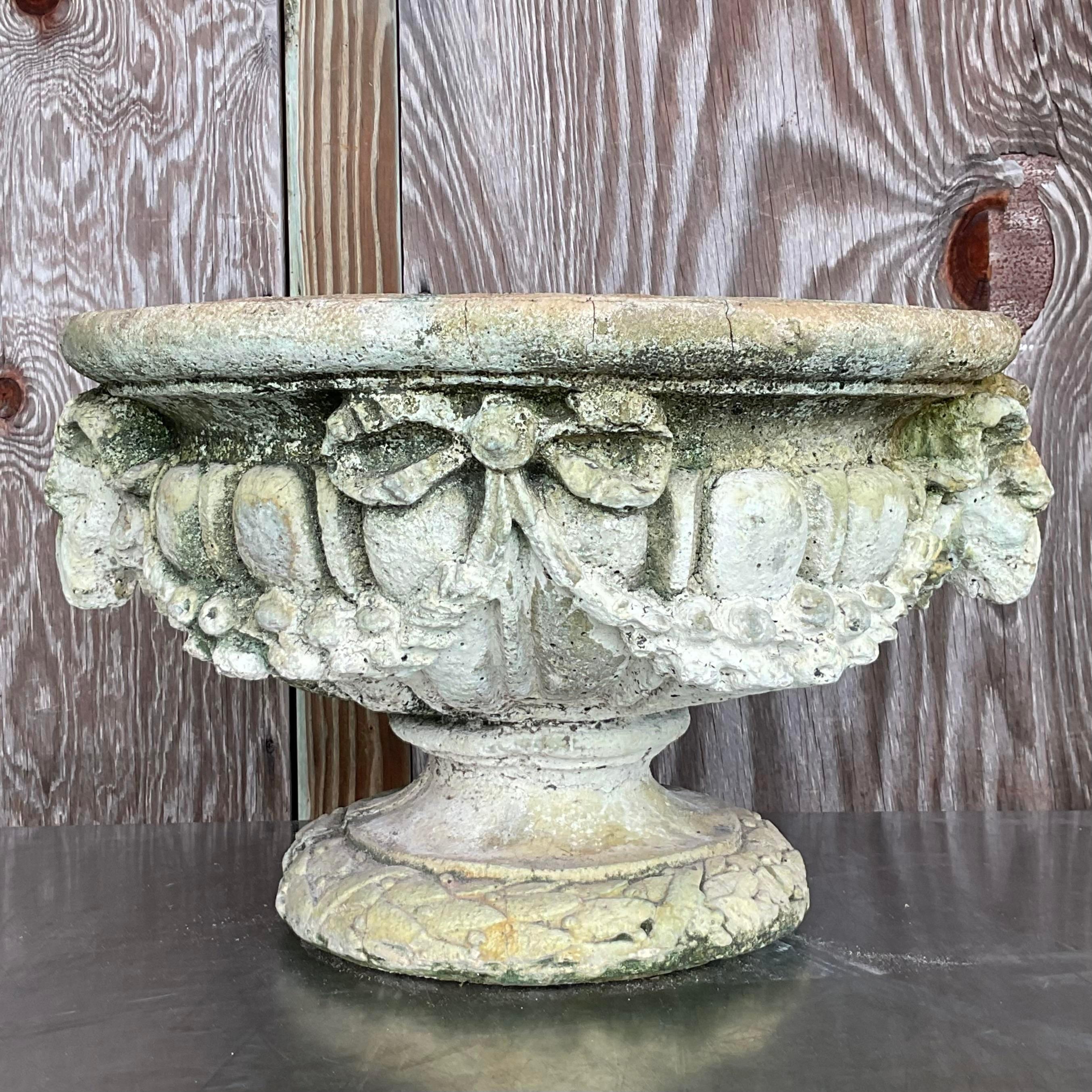 Elevate your garden or patio with the timeless elegance of this Vintage Regency Cast Concrete Swag Rams Head Planter. Perfect for American-style exteriors, this planter features intricate swag and rams head detailing, embodying the grandeur of