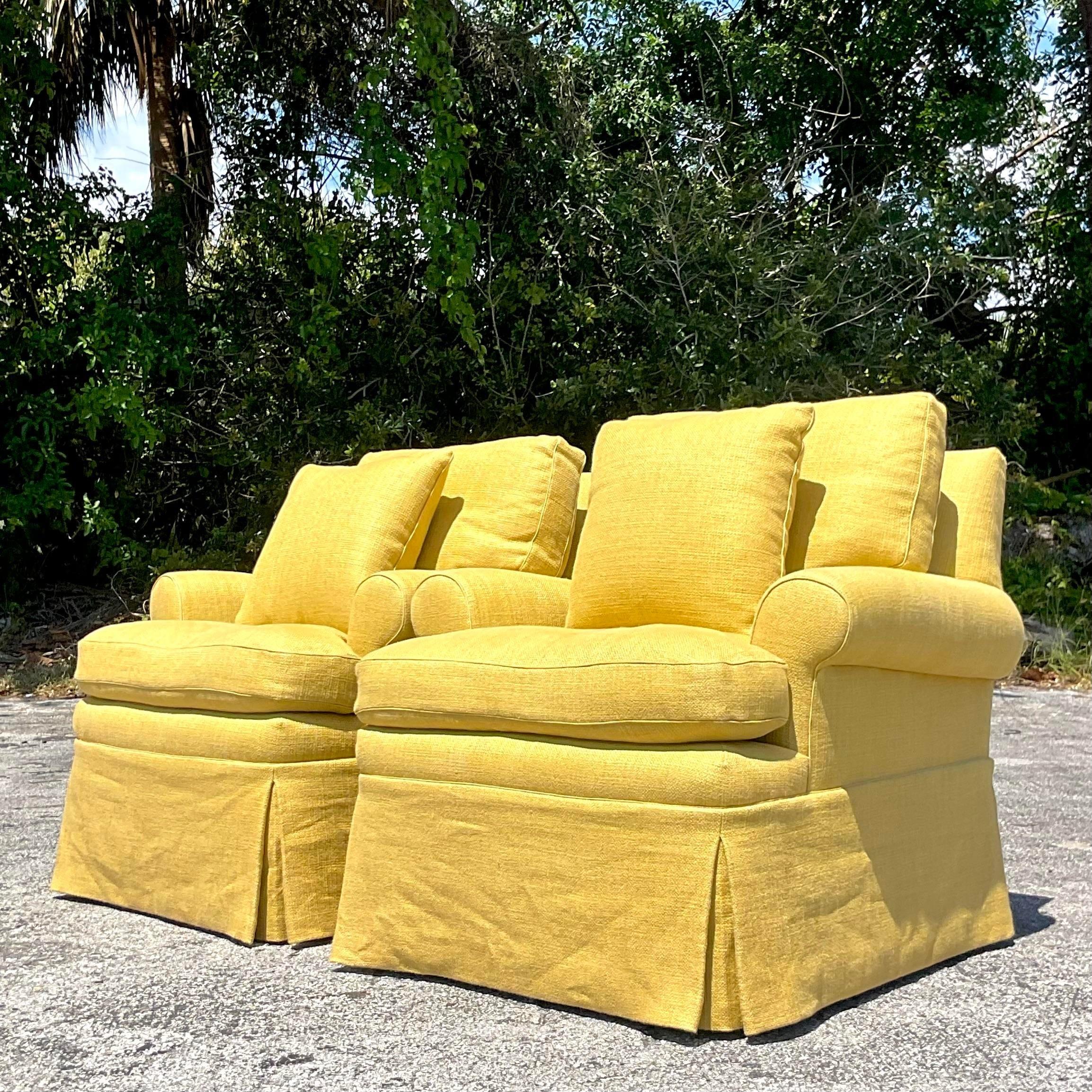 Introduce a pop of color and elegance with this pair of vintage Regency chartreuse lounge chairs. American-crafted with timeless style, these chairs offer both comfort and sophistication, making them a standout addition to any contemporary or