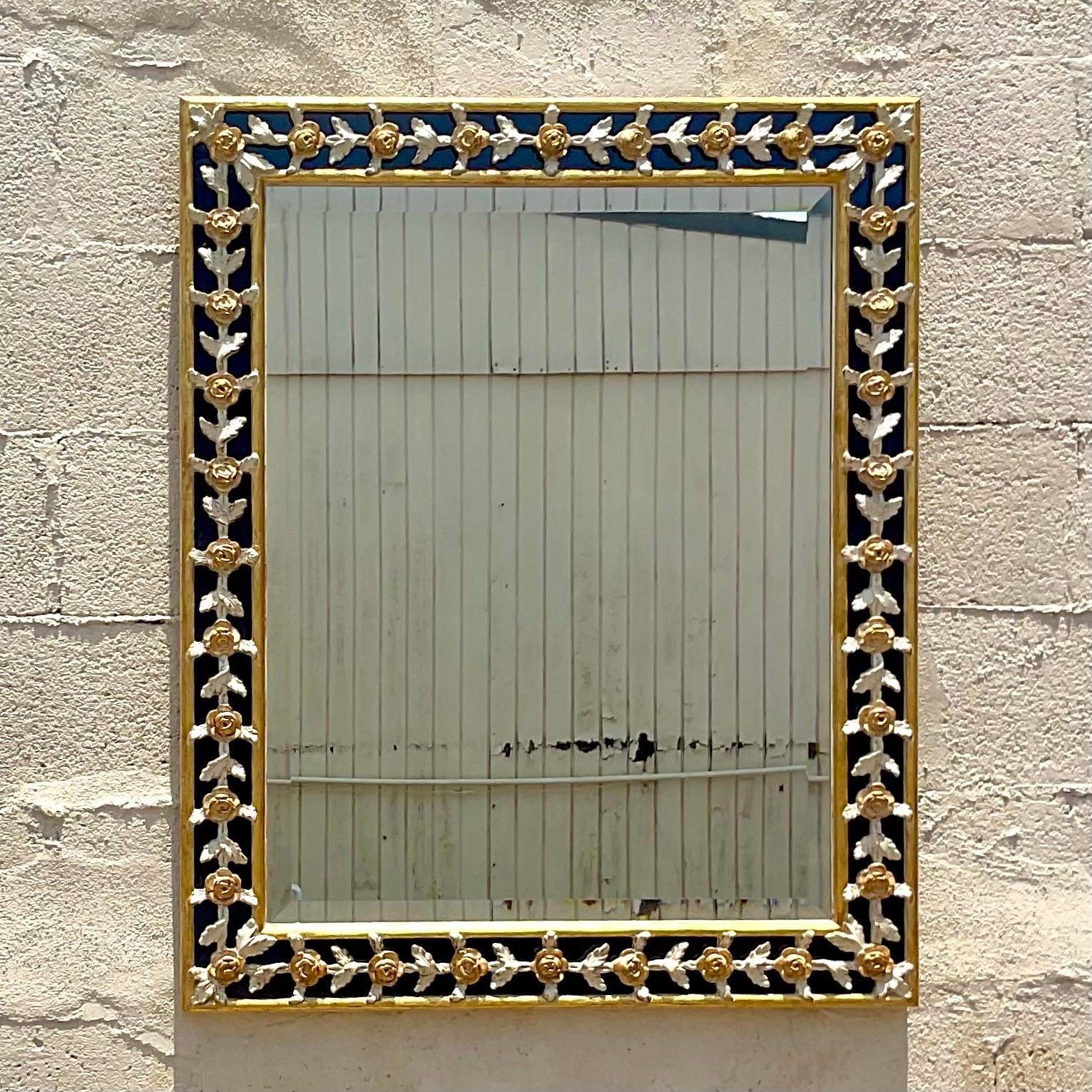 A fantastic vintage Regency wall mirror. Made by the coveted Giovanni Chellini group. Beautiful harp d carved detail with gilt tipping. Acquired from a Palm Beach estate. 