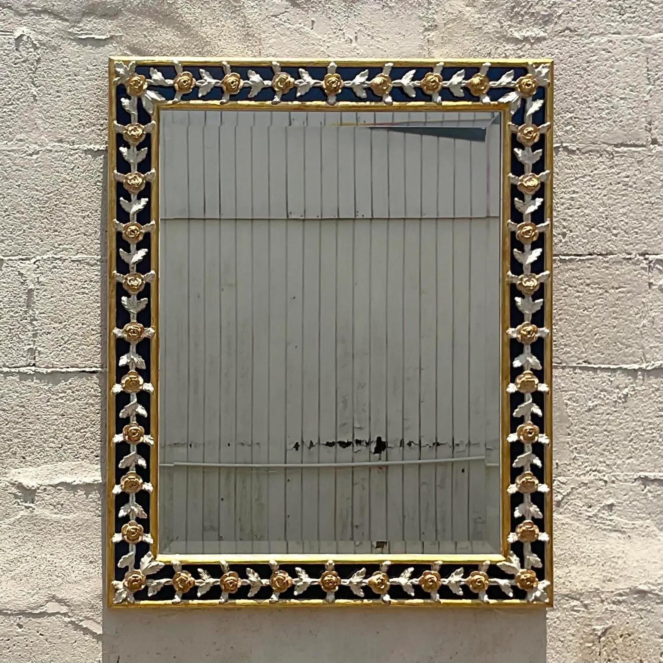 A fantastic vintage Regency wall mirror. Made by the coveted Giovanni Chellini group. Beautiful harp d carved detail with gilt tipping. Acquired from a Palm Beach estate