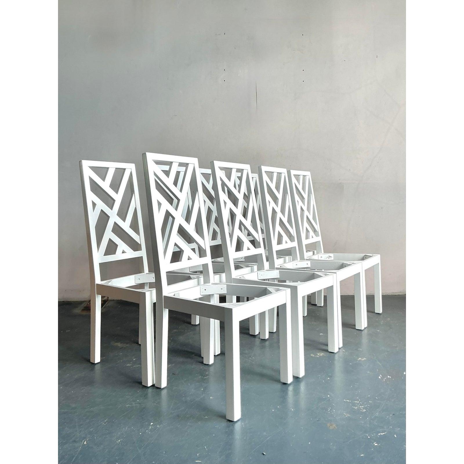 Presenting an exceptional set of eight vintage Hollywood Regency Chinese Chippendale dining chairs, ready to be customized to your exact specifications. These chairs epitomize timeless elegance with their iconic fretwork backs, a hallmark of the