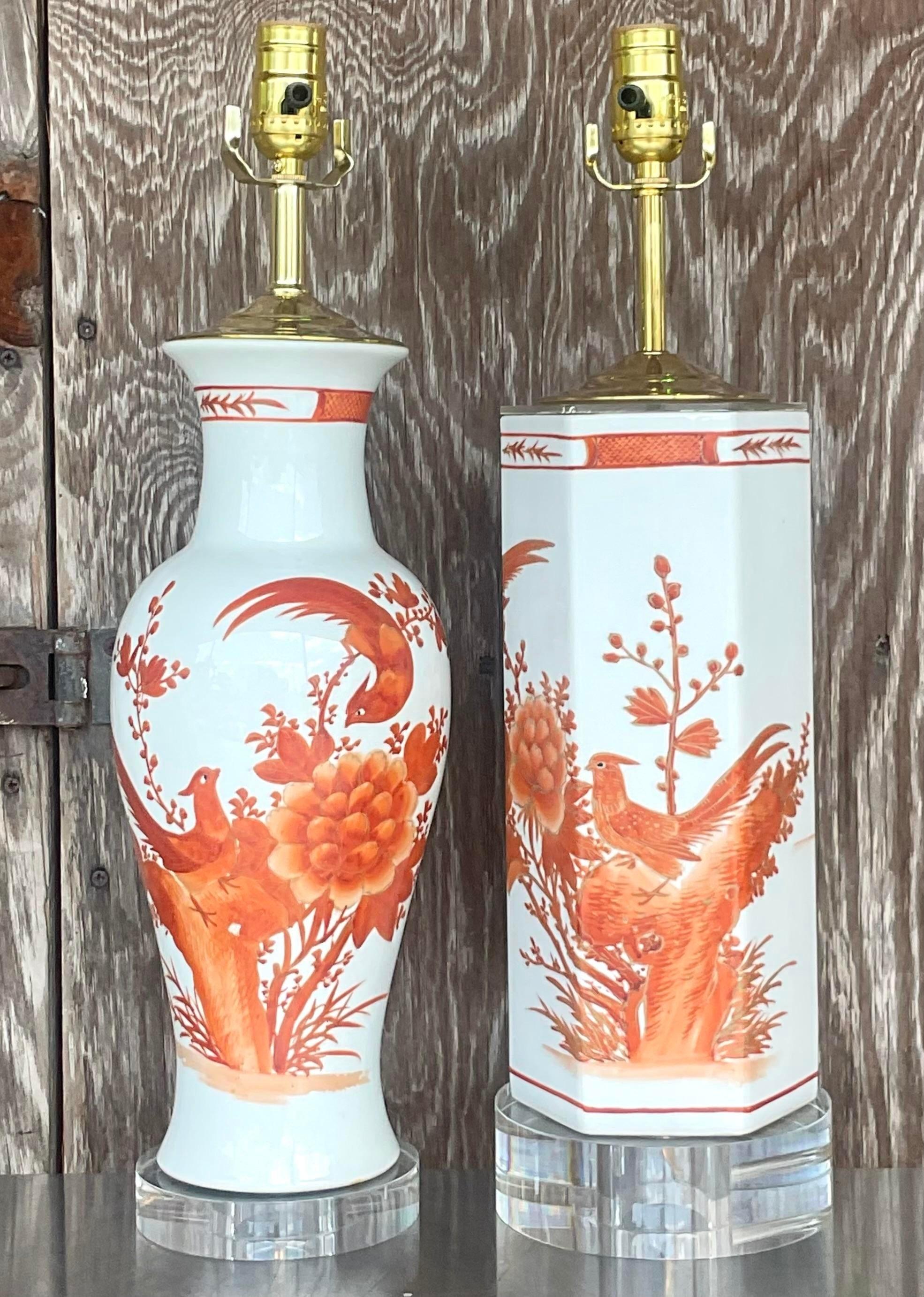 A fabulous set of vintage Asian table lamps. A chic set of Chinoiserie style lamps with the same motif and two different shapes. Fully restored with all new wiring and hardware. Acquired from a Palm Beach estate.