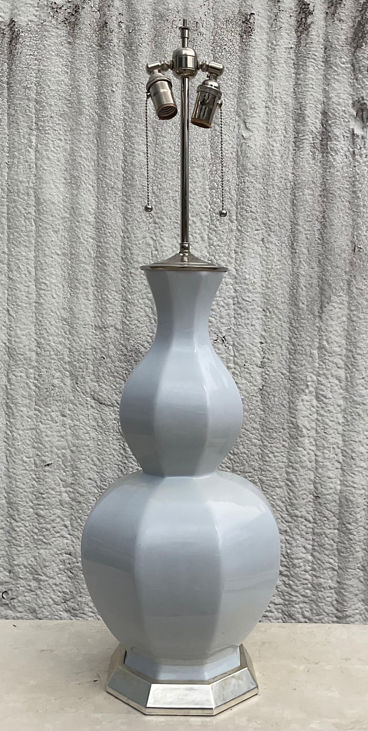 Incredible Monumental Christopher Spitzmiller lamp. A beautiful pale blue glazed ceramic body with silver leaf plinth and polished nickel hardware. Acquired from a Palm Beach estate.