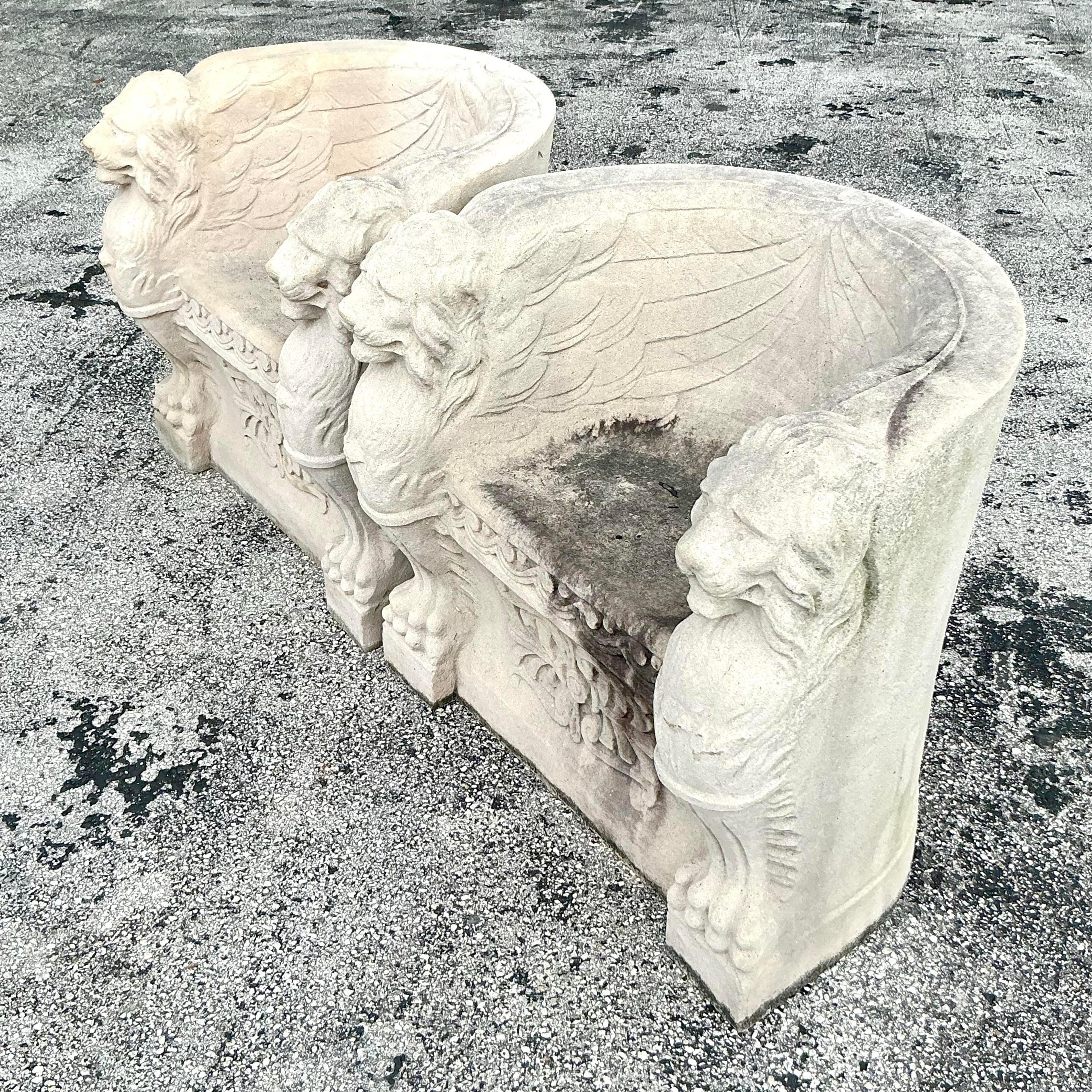 Elevate your space with the grandeur of these Vintage Regency Concrete Over Fiberglass Winged Lion Chairs. Perfect for American-style interiors, these striking chairs feature majestic winged lion designs, blending classical elegance with durable