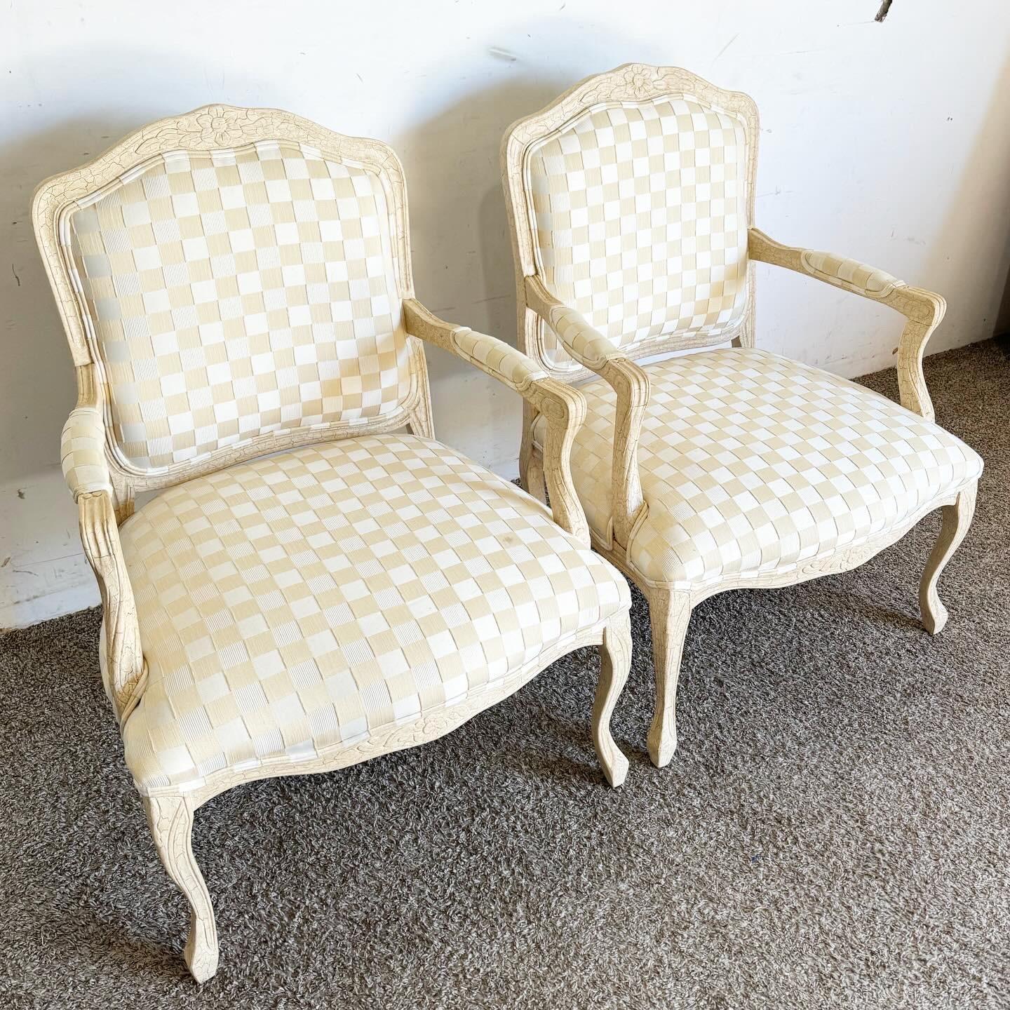 Elevate your space with these Vintage Regency Cream Crackled Armchairs. Boasting classic elegance, detailed carvings, and luxurious upholstery, they're perfect for adding vintage charm and comfort to any room.