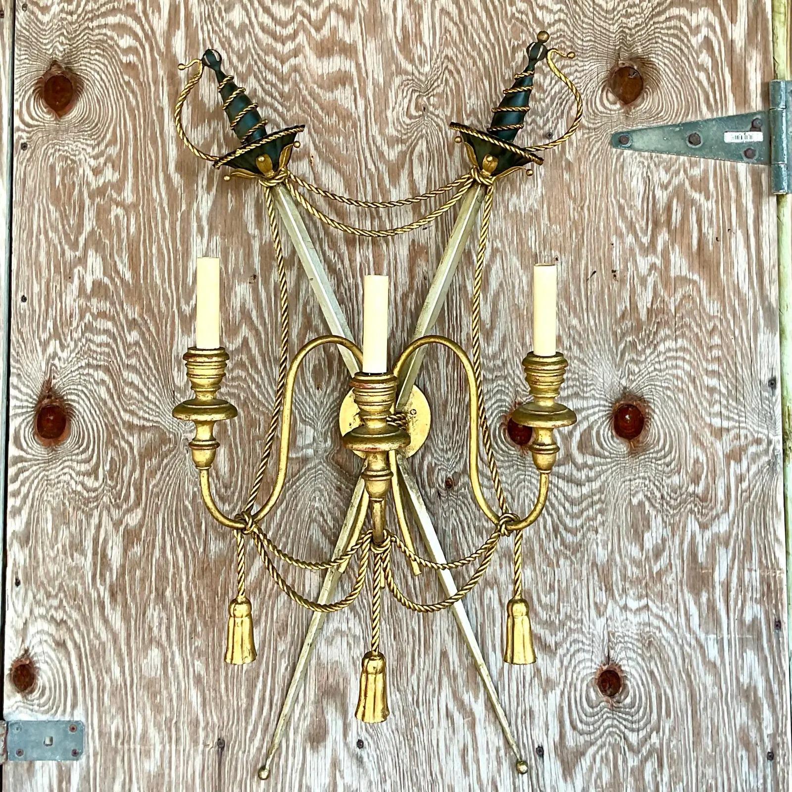 Incredible vintage regency wall sconce. A glamorous swag design with two crossed swords. Acquired from a Palm Beach estate.