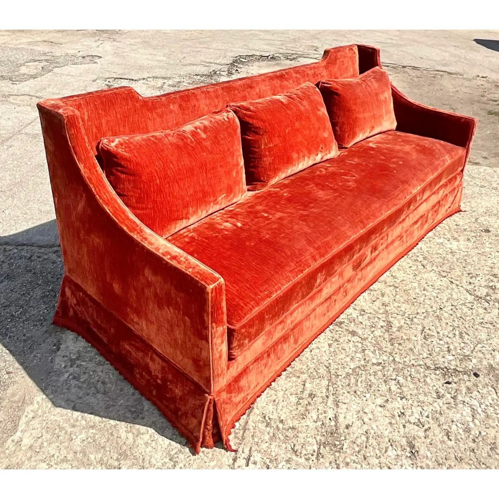 Spectacular vintage custom built Frank Parker sofa. A monumental size in a chic high back design. Deep orange crushed velvet with a beautiful warm sheen. Acquired from a Palm Beach estate.
