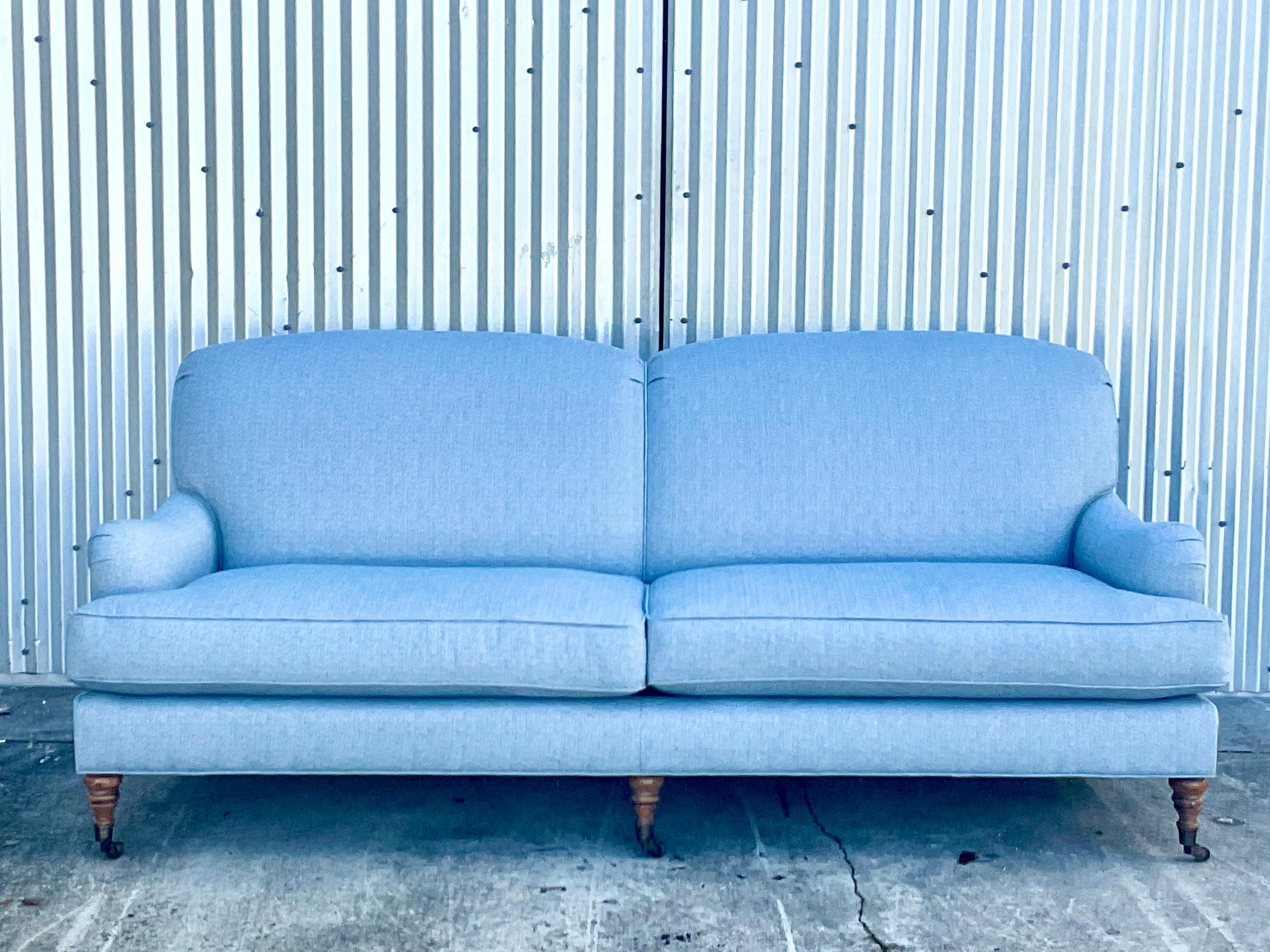 Incredible custom roll arm sofa. Impeccably built and covered in a blue herringbone Schumacher performance fabric. Less than one year old and in pristine condition. Acquired from an El Cid estate.