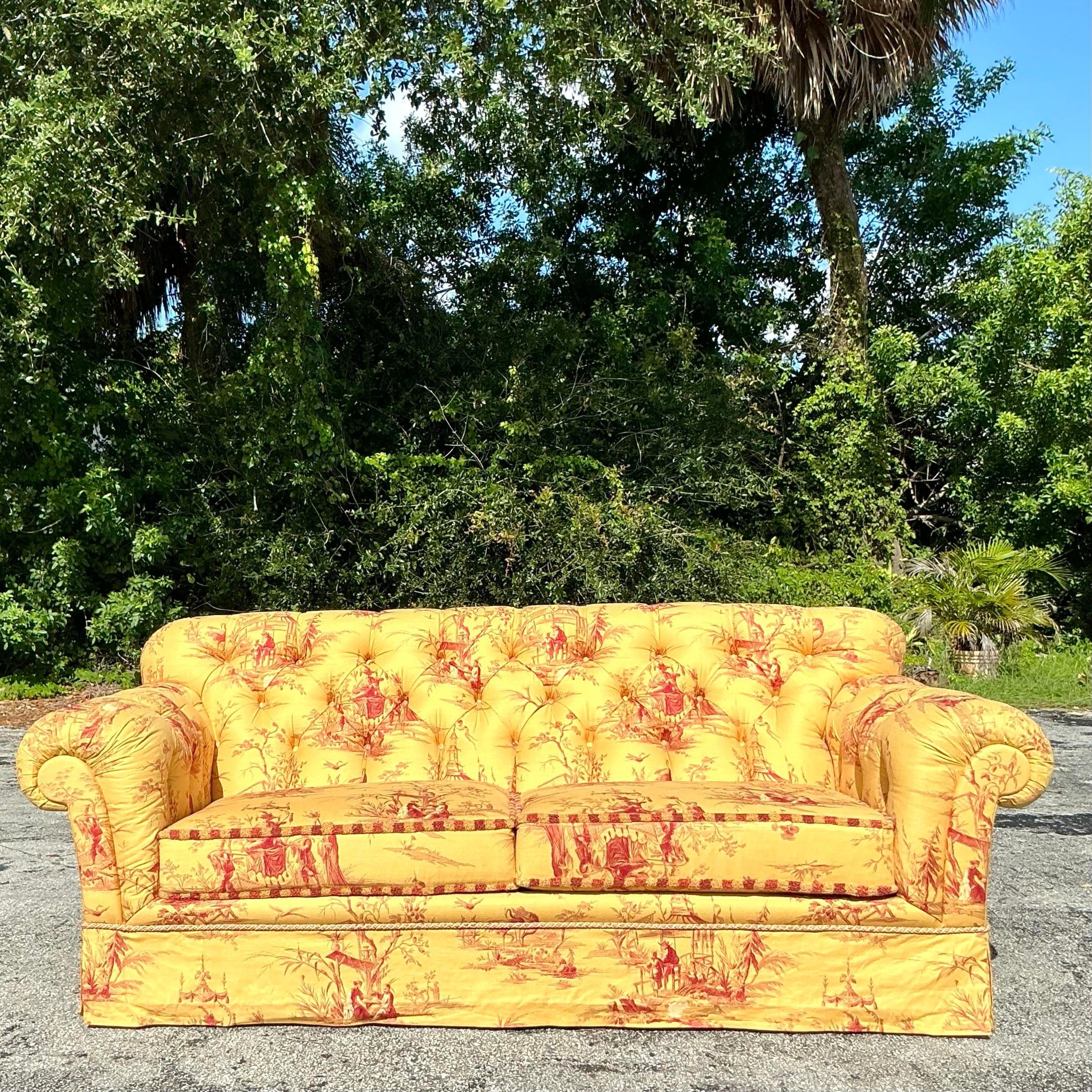 Vintage Regency Custom Tufted Sofa in Pierre Frey Chinoiserie fabric, combining classic tufting with vibrant, exotic patterns. A luxurious centerpiece for any refined living area. Acquired from a Palm Beach estate