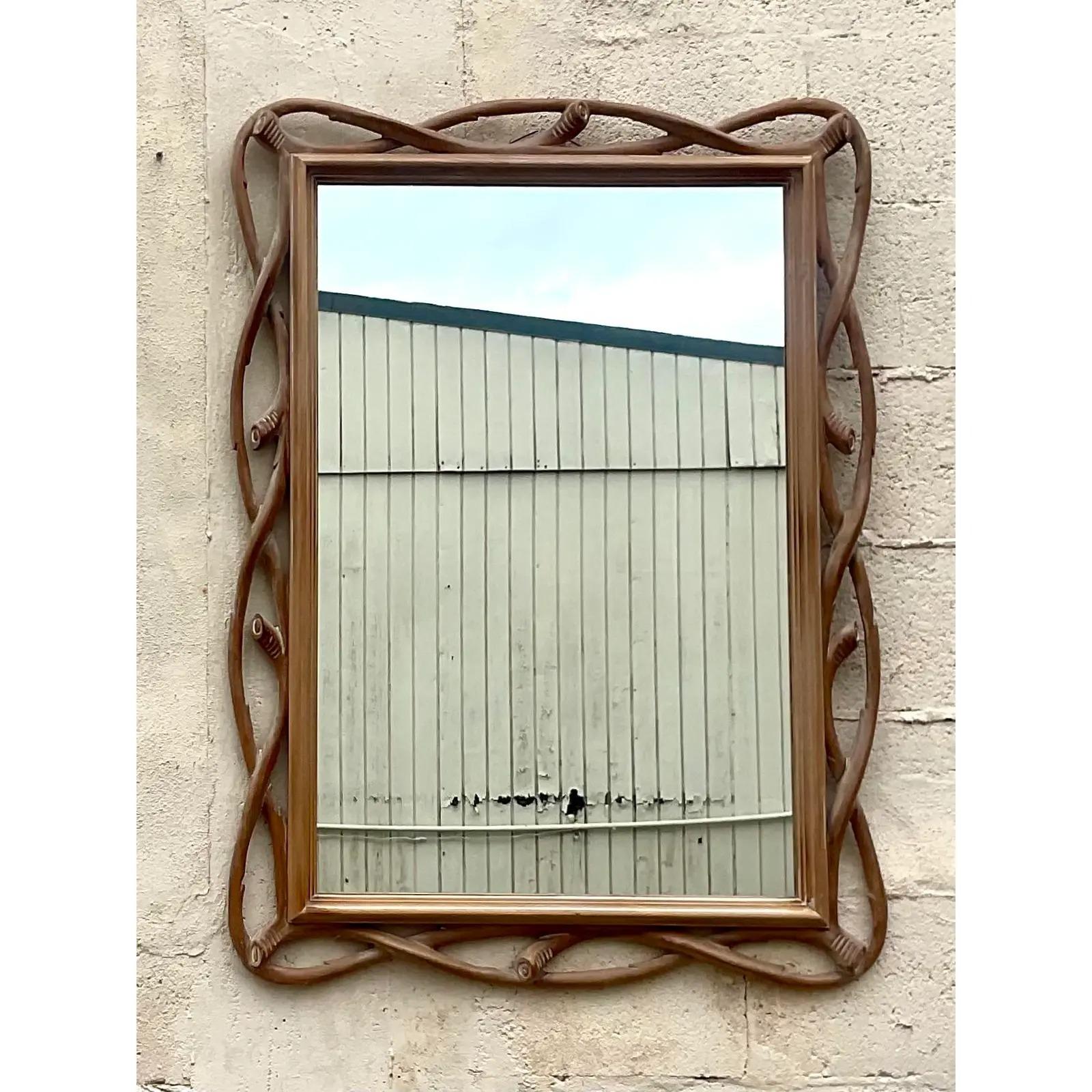 A stunning vintage Regency 80s wall mirror. Made by the iconic Decorative Crafts Group. Beautiful Faux Bois design with a very light cerused finish. Acquired from a Palm Beach estate.
