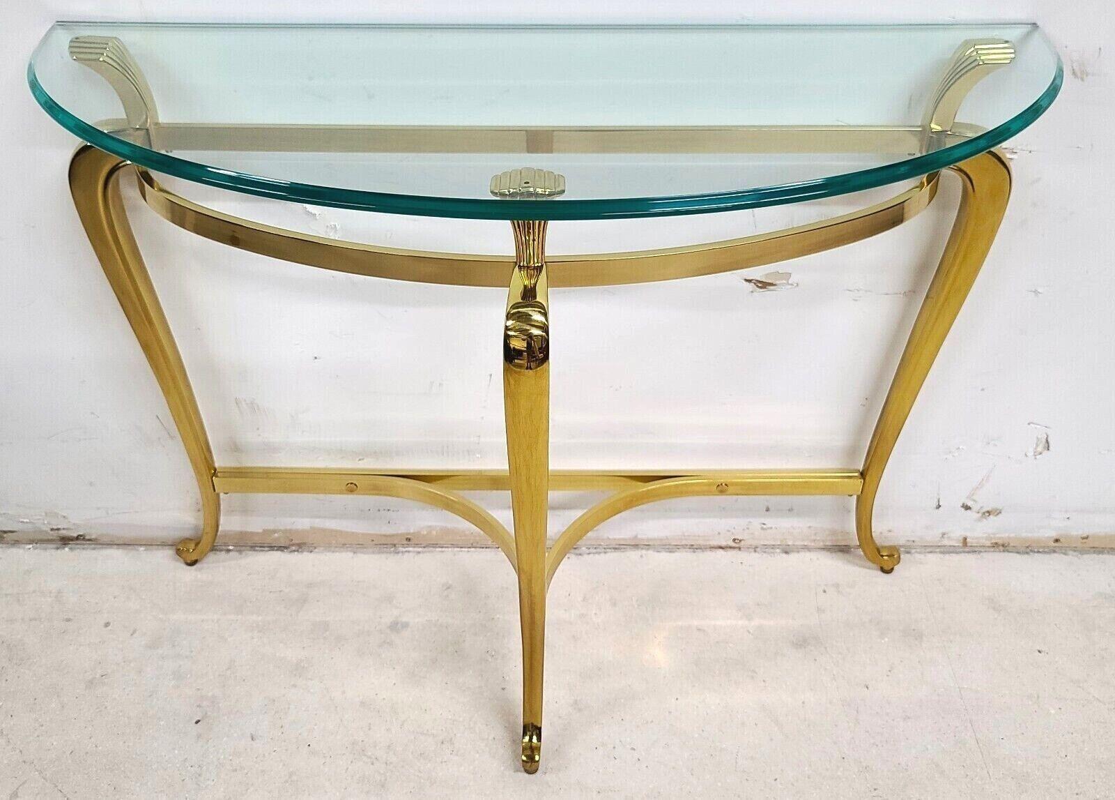 Offering One of our recent palm beach estate fine furniture acquisitions of a
Vintage Maison Jansen Regency style Demilune solid brass console table
This is a very well-made, high-end piece with Ogee edge glass and a top-quality solid (not plate)