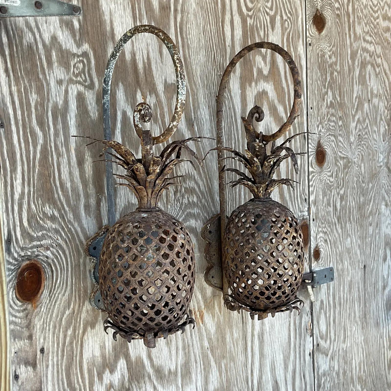An incredible pair of vintage copper pineapple copper sconces. The most beautiful punch cut detail with lots of charming leaves. The perfect amount of distressed finish. Keep as is or paint them up. You decide! Acquired from a Palm Beach