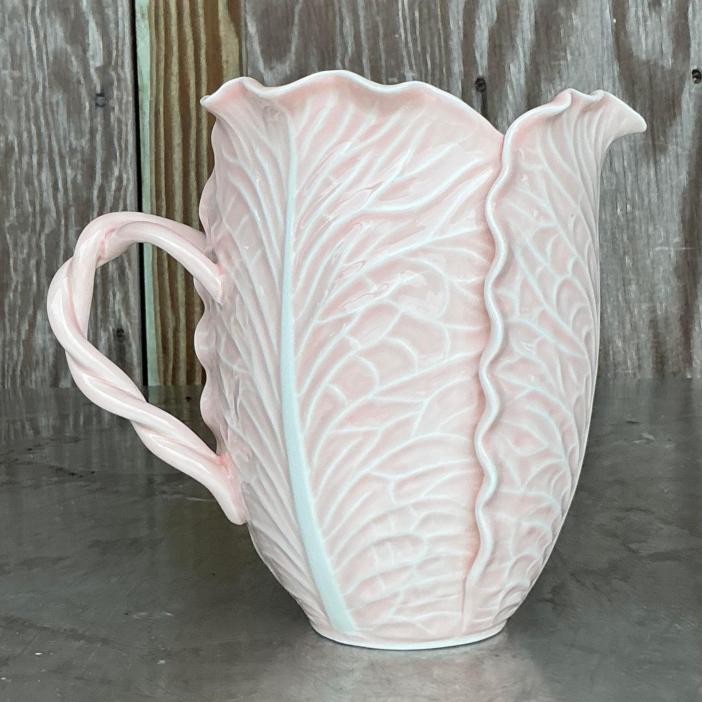 Add a touch of refined elegance to your collection with this set of 2 Vintage Regency Dodie Thayer for Tory Burch Pitchers. Known for her iconic lettuce ware, Dodie Thayer's collaboration with Tory Burch brings timeless style and playful