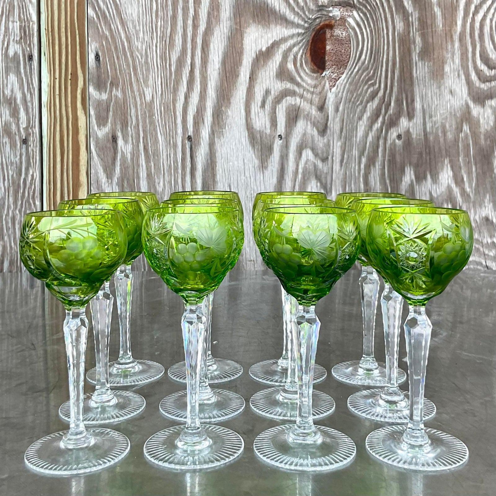 A stunning set of vintage Regency wine glasses. Chic emerald cut crystal in a floating leaf motif. Long faceted stems. Acquired from a Palm Beach estate