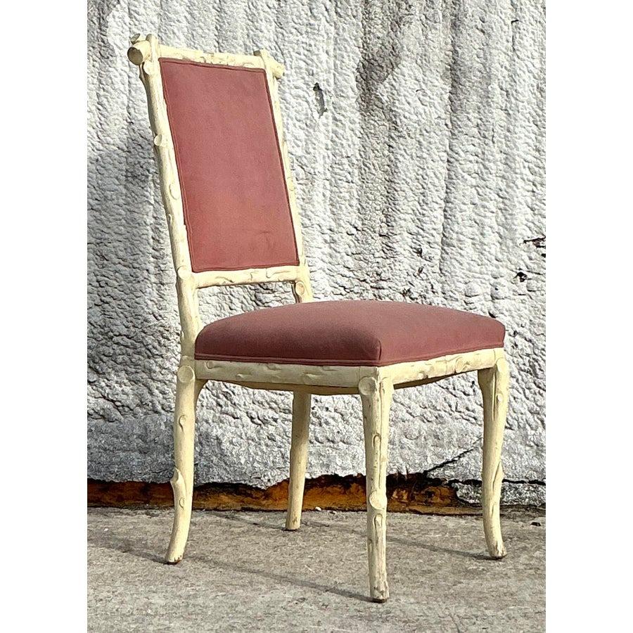 Introduce a touch of natural elegance with this vintage Regency faux bois chair. Crafted with intricate faux bois detailing that mimics the look of wood grain, this chair combines timeless Regency sophistication with rustic charm. The upholstered