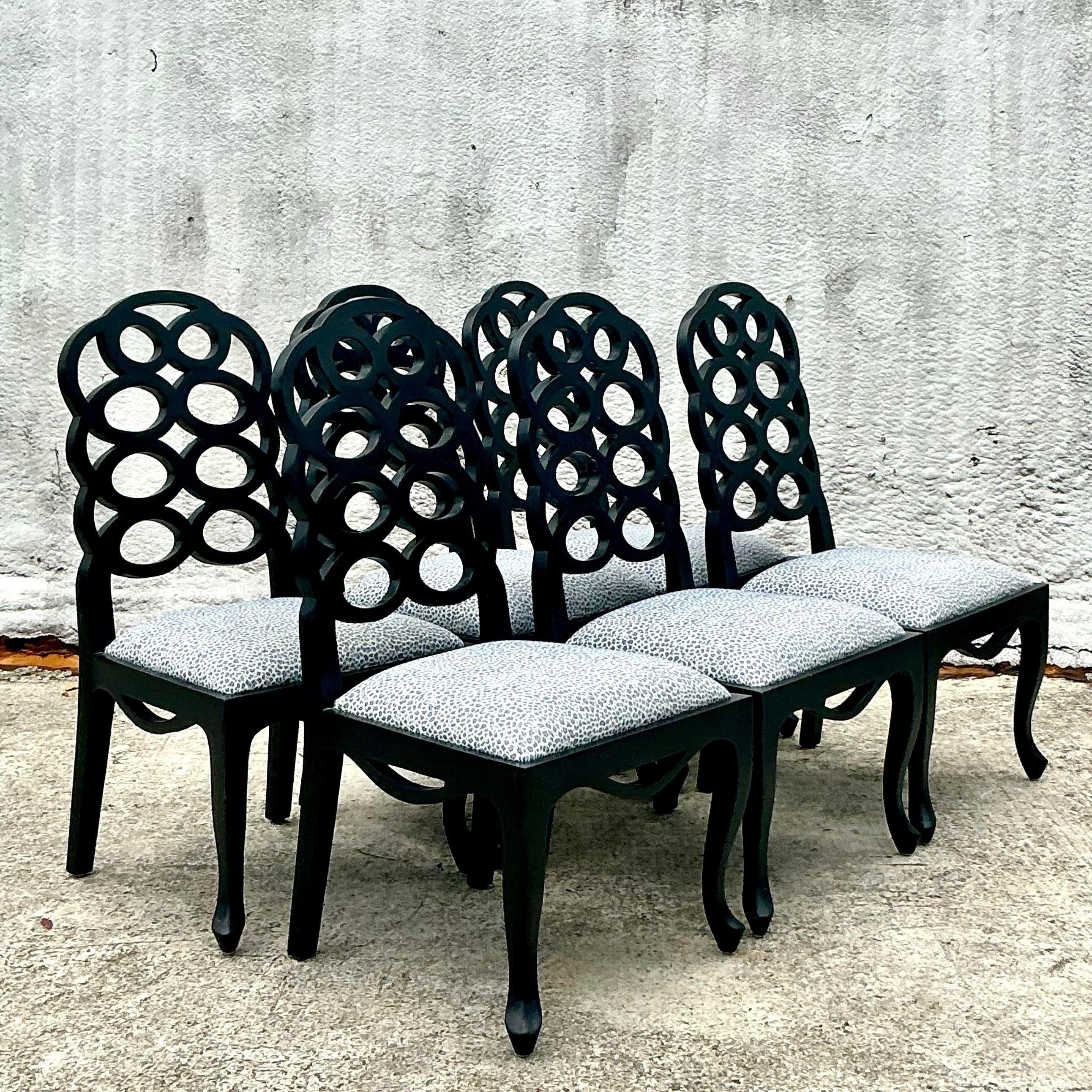 Elevate your space with this set of 6 Vintage Regency Frances Elkins Loop Chairs. Featuring iconic loop backs and sleek lines, these chairs blend classic elegance with modern flair, perfect for dining or accent seating. Durable and timeless, they’re