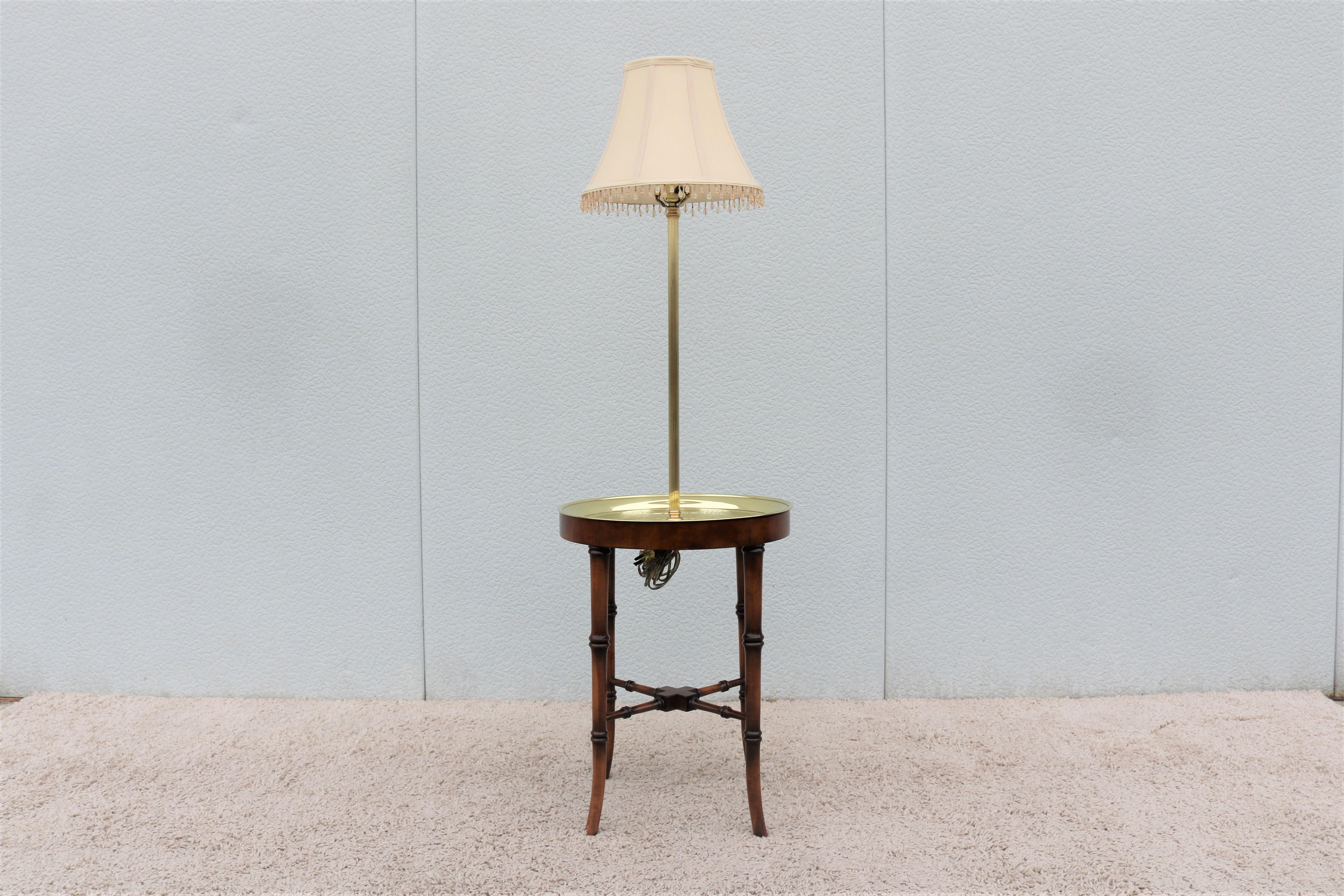 Fabulous vintage Regency style Frederick Cooper faux bamboo wood and etched brass tray side table floor lamp.
Features solid wood carved faux bamboo base having four legs conjoined with X stretcher and a superb etched solid brass tray.
Shade