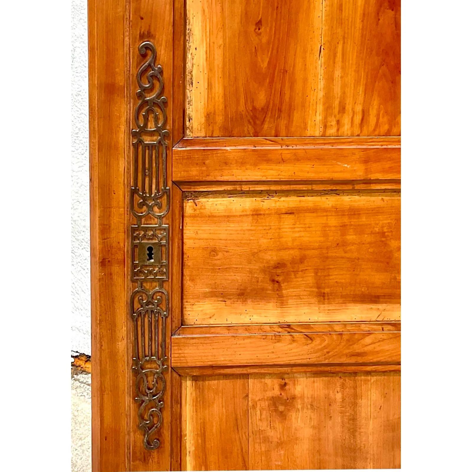 A fantastic vintage French Armoire. Beautiful hand carved detail with heavy brass hardware. Tall and impressive. Acquired from a Palm Beach estate. 

The armoire is in great vintage condition. Minor scuffs and blemishes appropriate to its age and