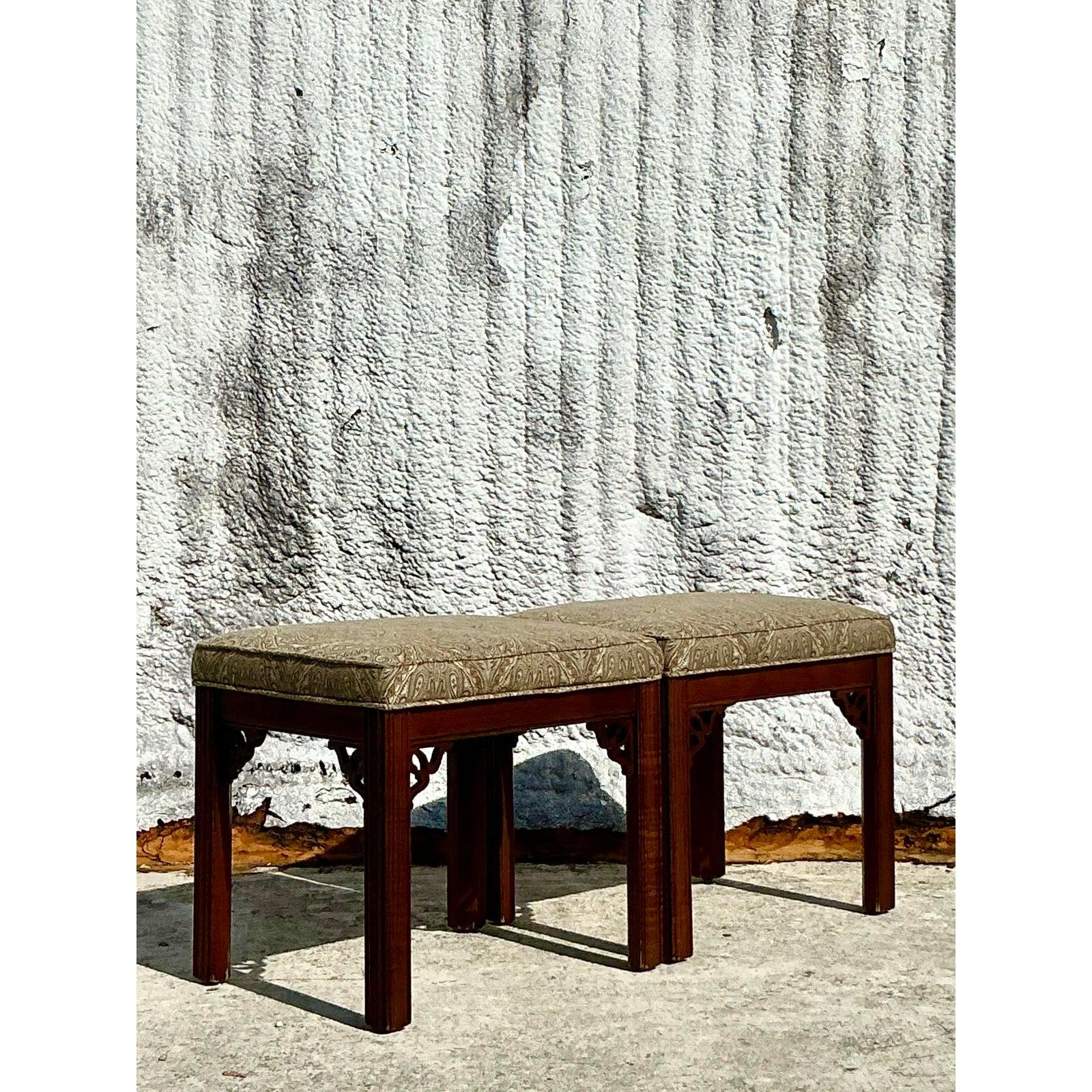 Add a touch of timeless elegance to your space with this pair of vintage Regency-style fretwork low stools. Featuring intricately carved wooden frames with decorative fretwork details, these stools offer a blend of refined craftsmanship and classic
