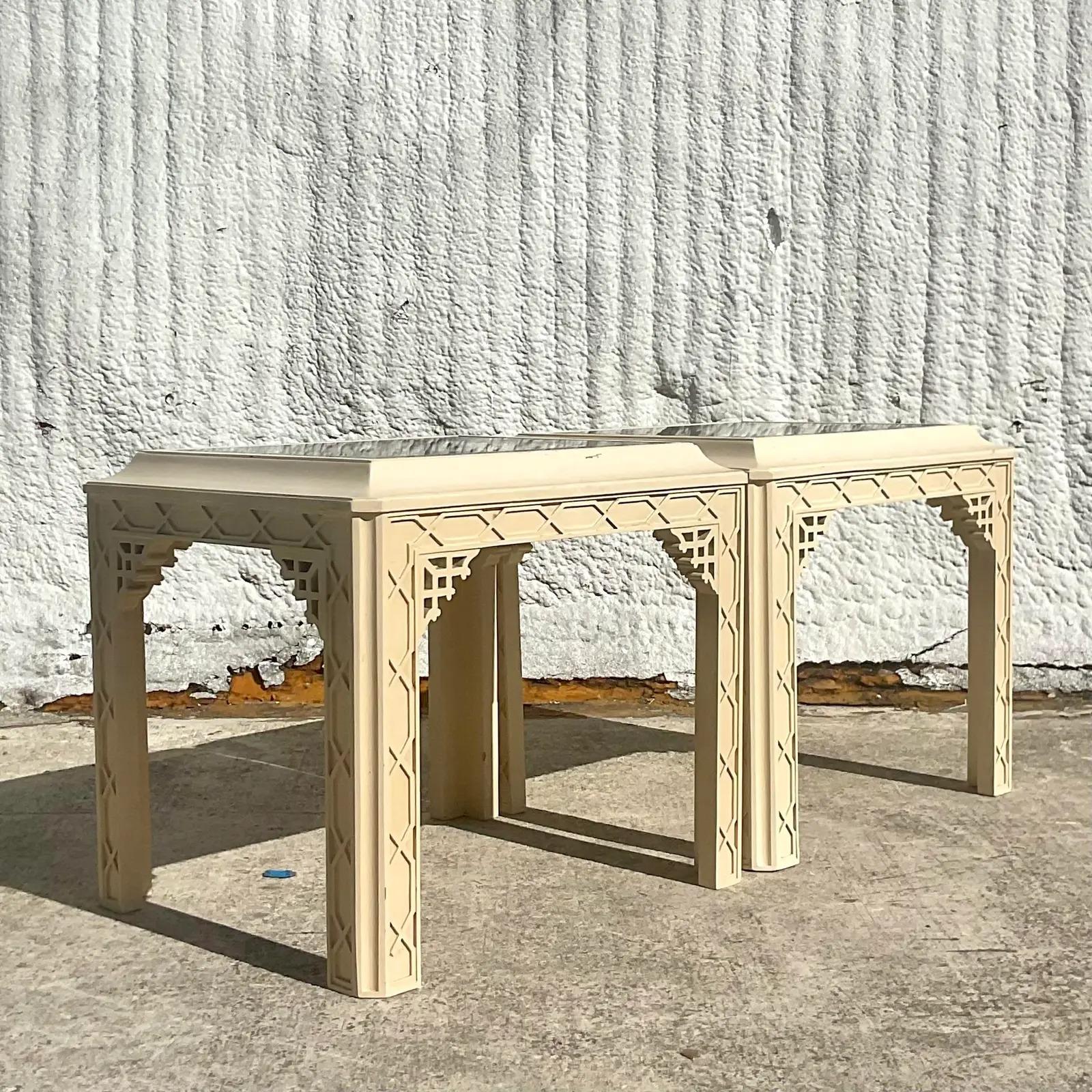 A fabulous pair of vintage Regency side tables. Chic pagoda style with gorgeous fretwork detail. Inset smoked mirror top for extra glamour. Acquired from a Palm Beach estate.