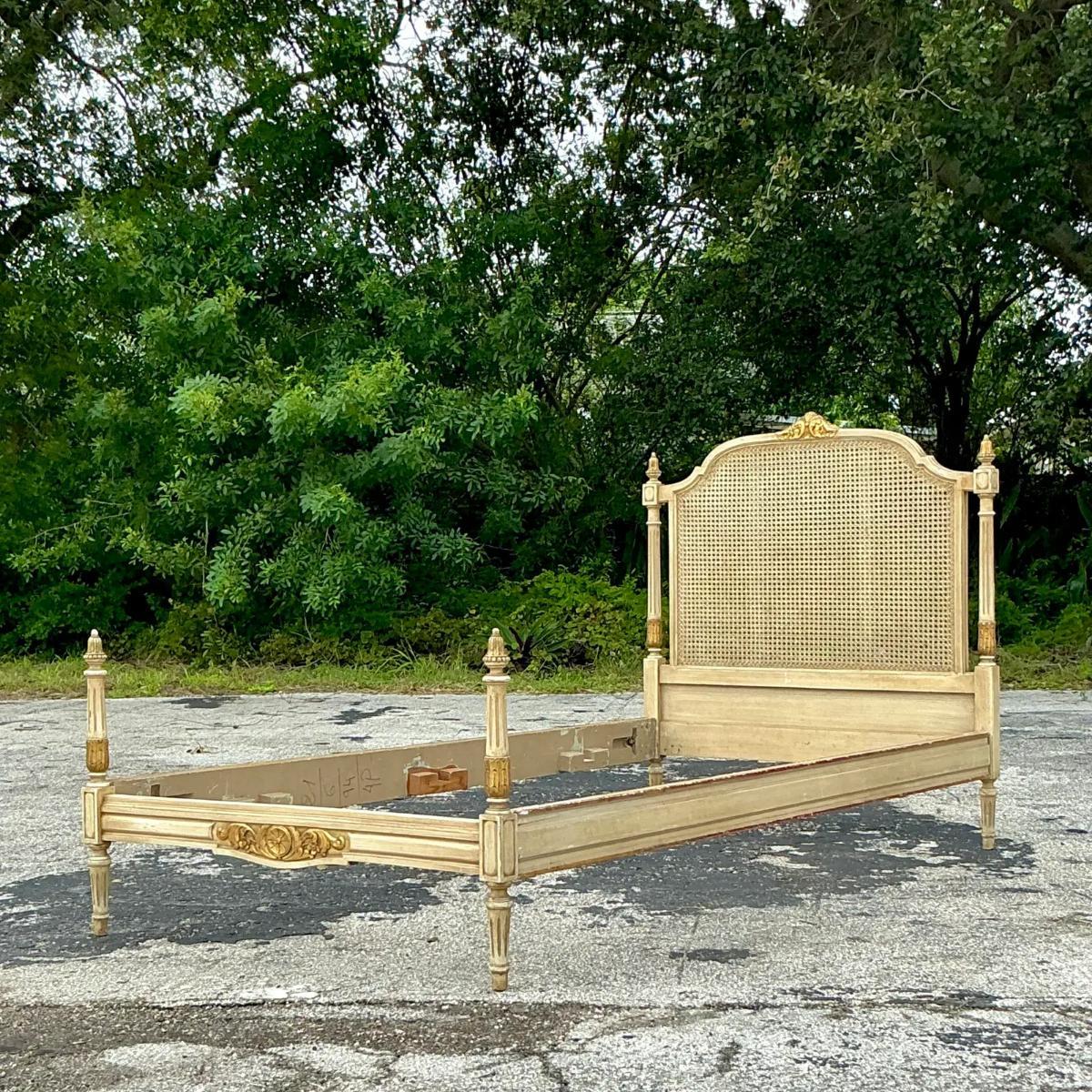Add a touch of regal elegance to your bedroom with this Vintage Regency Gilt Tipped Cane Twin Bedframe. Featuring classic Regency design elements, this bedframe boasts beautifully crafted cane panels accented with luxurious gilt-tipped detailing,