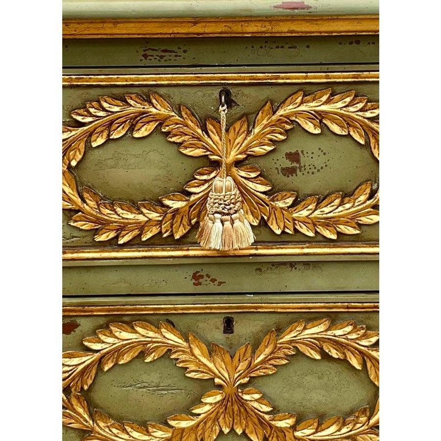 Elevate your space with this stunning pair of vintage Regency gilt-tipped commodes, exuding timeless elegance and sophistication. Featuring classic Regency styling with ornate gilt accents, these commodes offer a refined touch of luxury to any room.