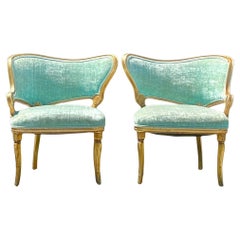 Paire de chaises à volutes dorées d'époque Régence