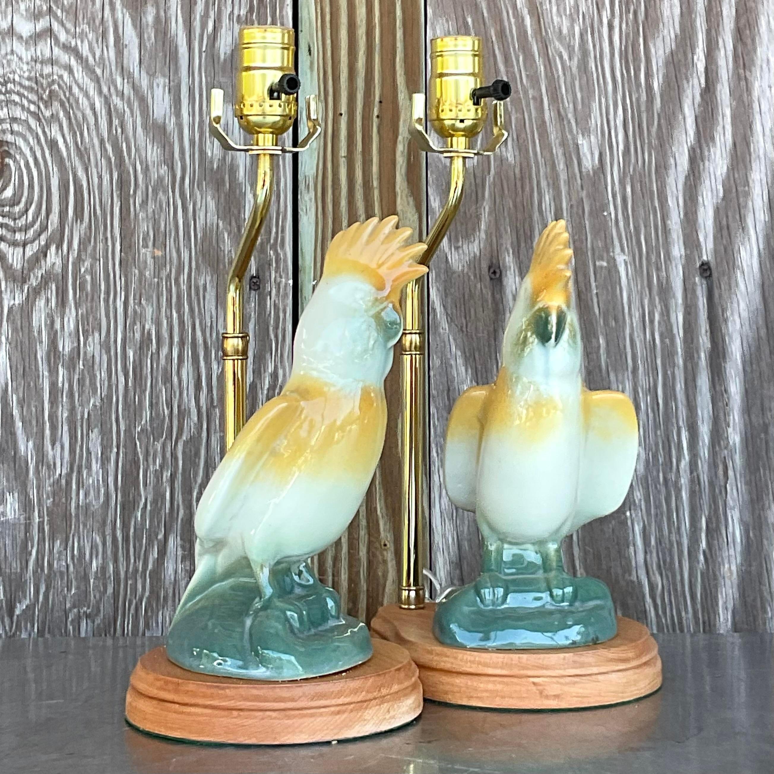 The Vintage Regency Glazed Ceramic Cockatoos - A Pair epitomize American style with their classic Regency design and exquisite glazed ceramic craftsmanship. These charming cockatoos add a touch of timeless elegance and whimsical charm to any