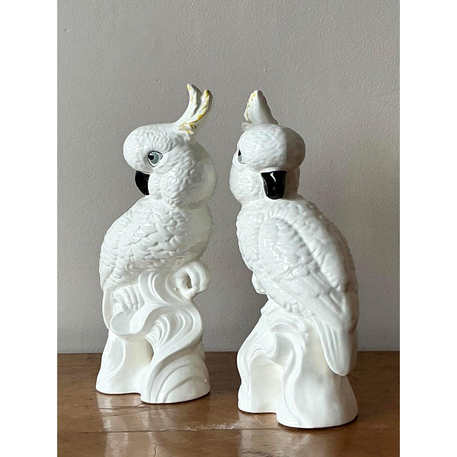 Add a touch of playful sophistication to your decor with this delightful vintage ceramic cockatoo sculpture. Captured in a charming pose with its head tilted inquisitively, this piece showcases beautiful craftsmanship with detailed feather textures