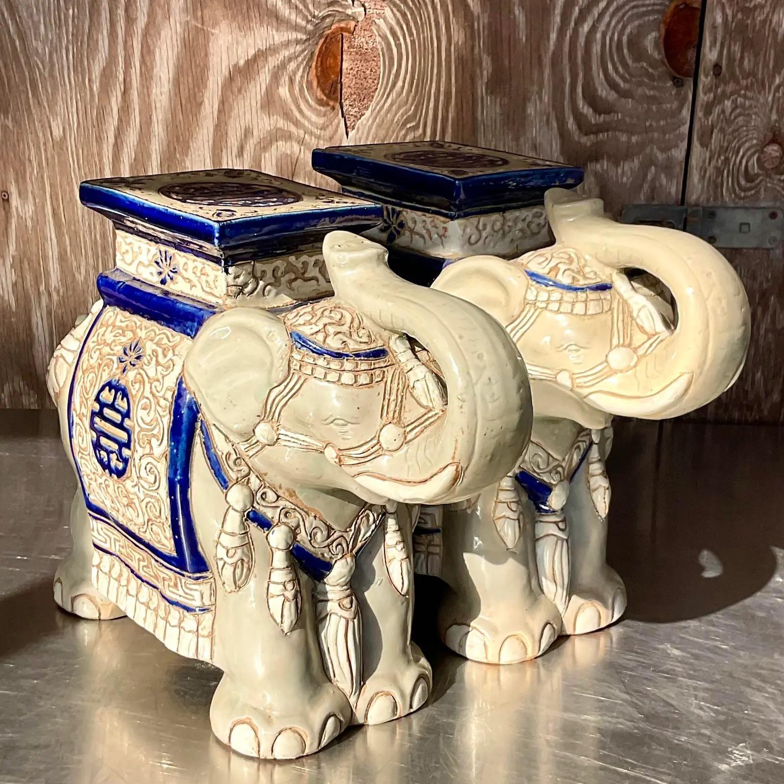 A fabulous pair of vintage Regency Elephants. A glazed ceramic finish with hand painted detail. Perfect for your orchids or glass of wine. You decide. Acquired from a Palm Beach estate.