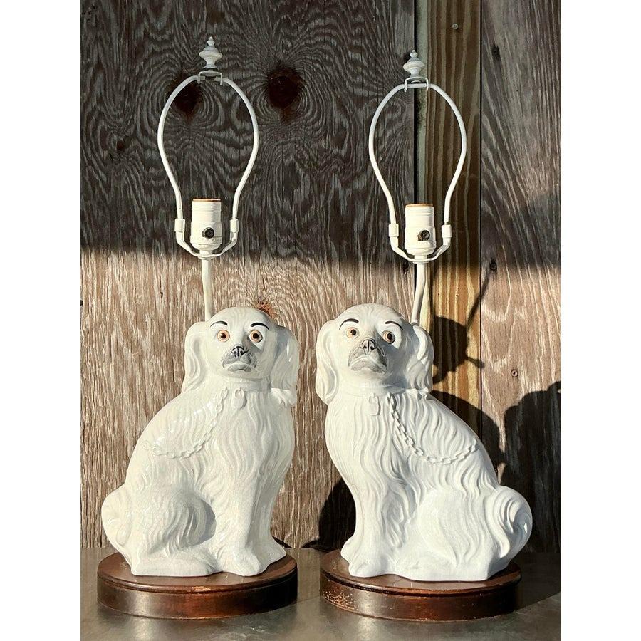 This charming pair of vintage Staffordshire dog lamps brings timeless regency style to your interior. Crafted with a glazed ceramic finish, these lamps feature the iconic Staffordshire dog design, complete with detailed textures and expressive