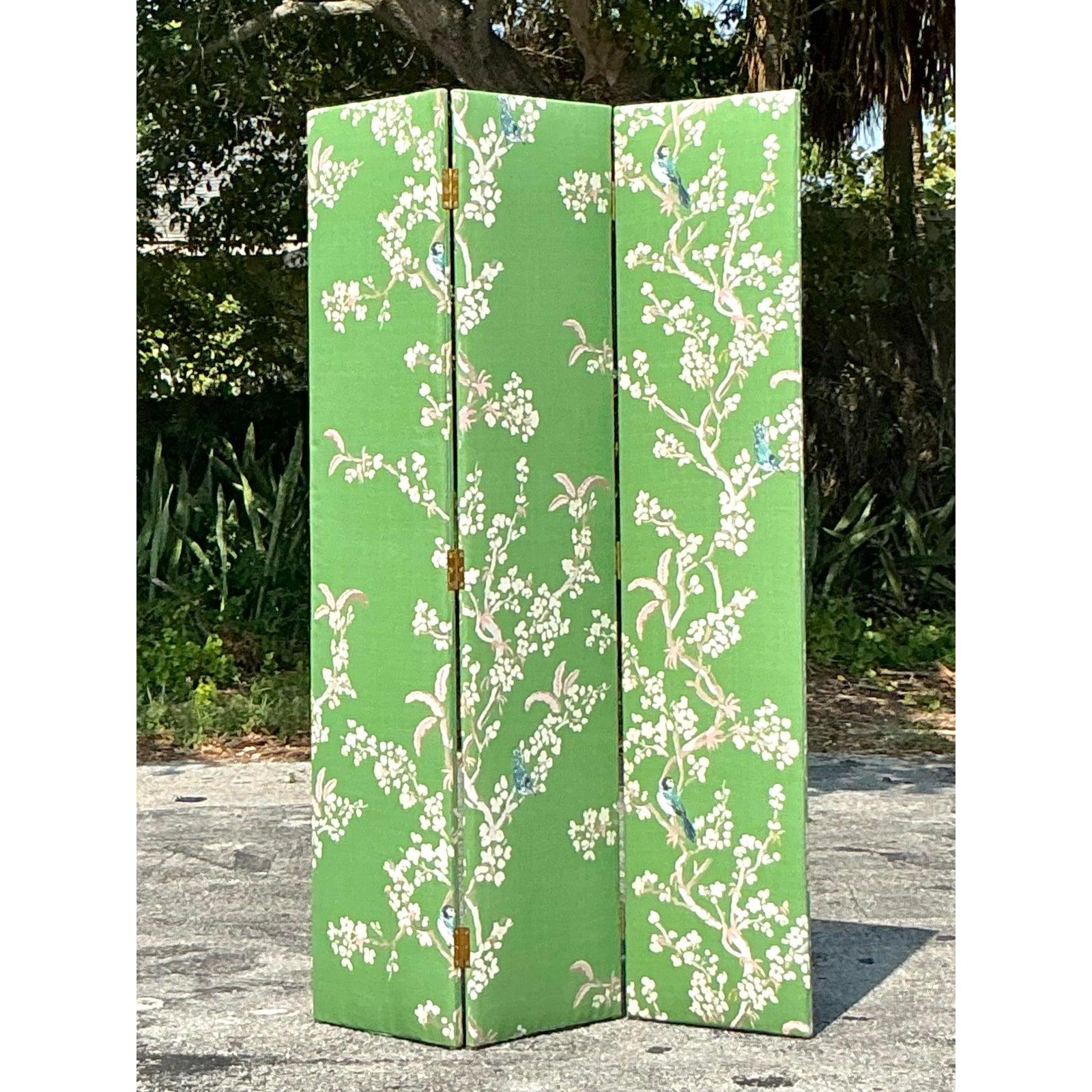 Add a touch of timeless elegance to your space with this Vintage Regency Gracie Style Upholstered Three Panel Screen. Featuring a vibrant botanical and bird motif set against a striking green backdrop, this piece channels the luxurious charm of