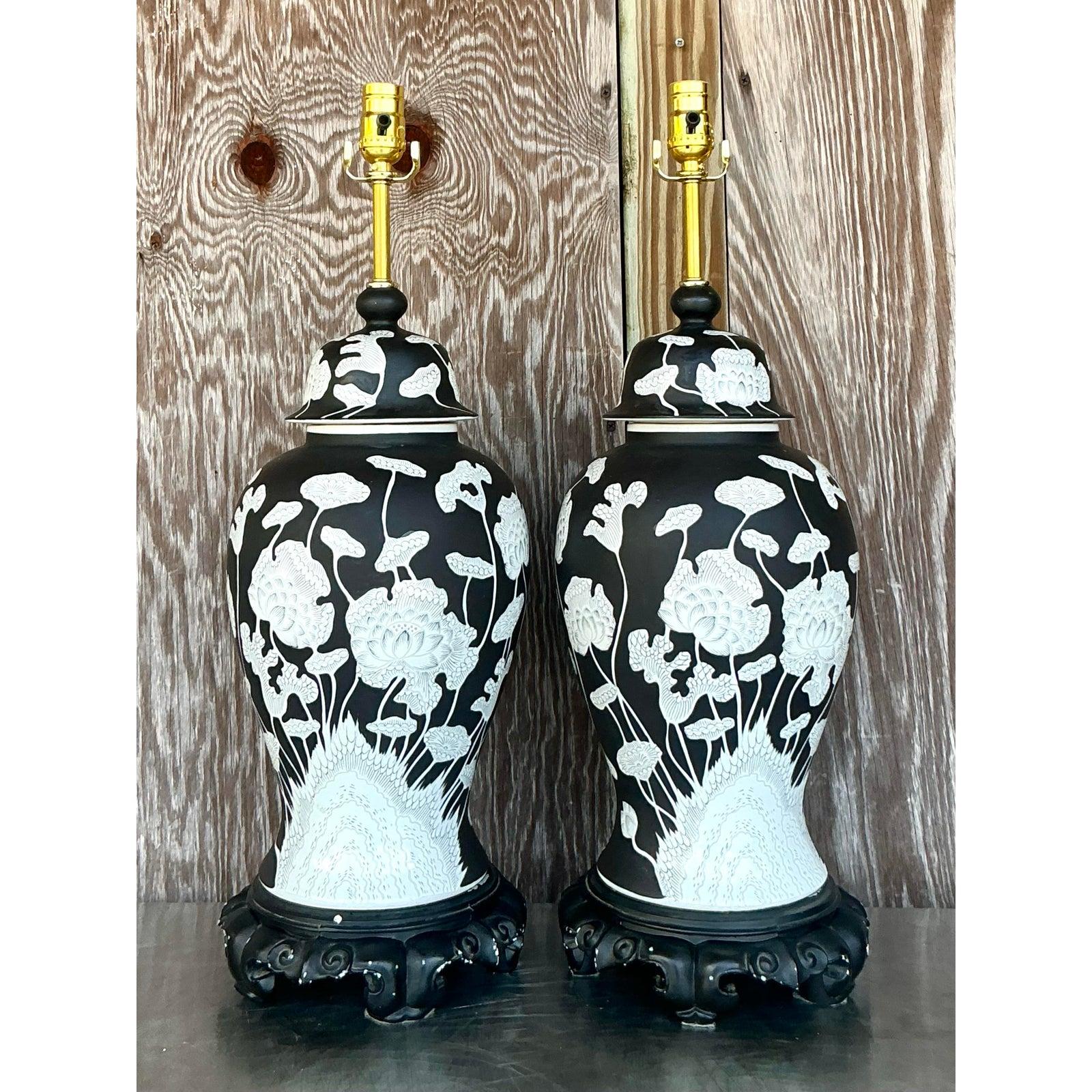Command attention with this striking pair of Vintage Regency Graphic Floral Ginger Jar Lamps, a harmonious fusion of classic elegance and bold visual appeal. Each lamp features an iconic ginger jar silhouette, exquisitely rendered in a sophisticated