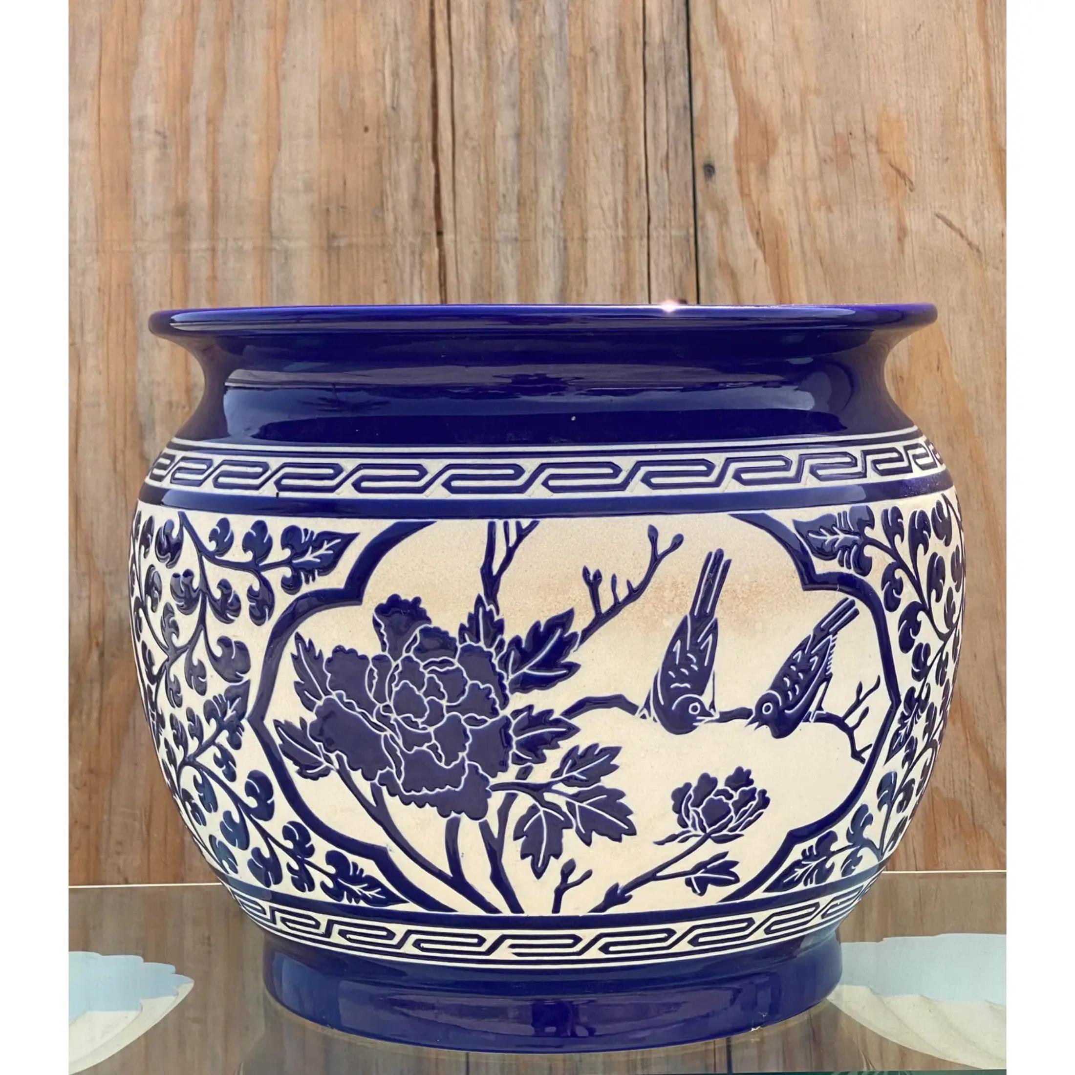Fantastic vintage blue and white planter. Beautiful Greek Key trim above a floral garden scene. Acquired from a Palm Beach estate
