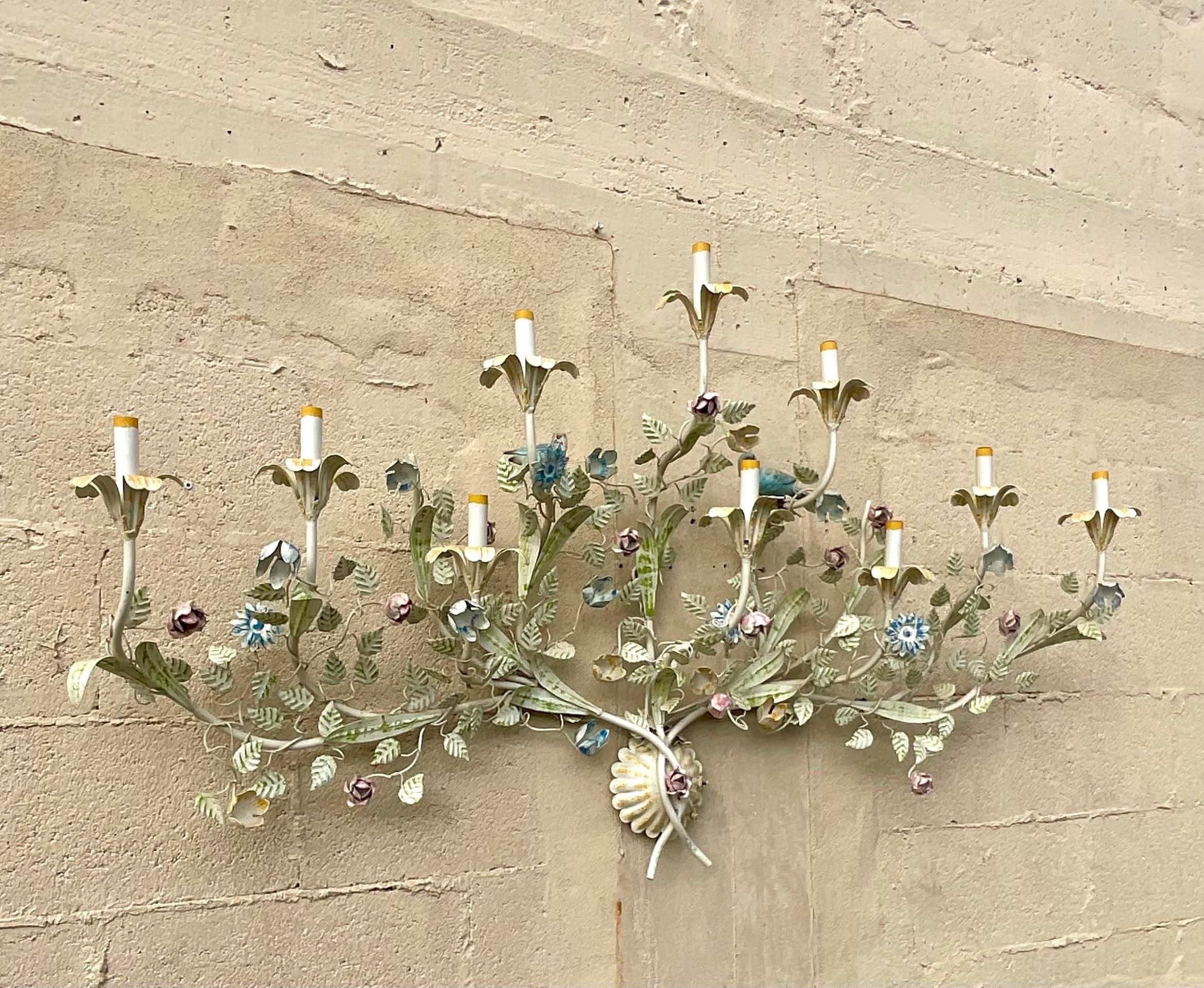 A stunning vintage Boho wall lamp. A chic floral design complete with beautiful little birds. Hardwares and ready for you to add a flash of charm to any space. Acquired from a Palm Beach estate.