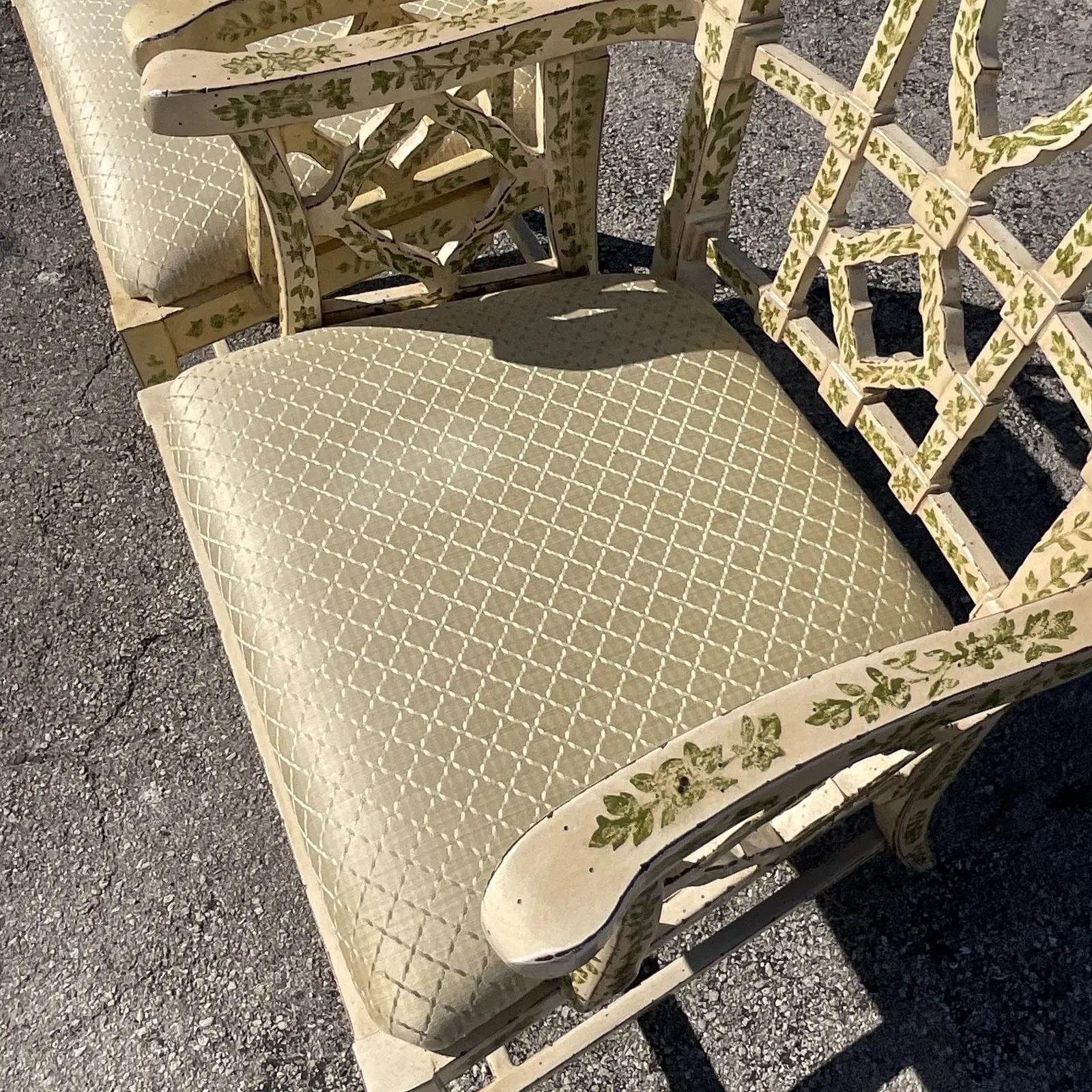 A fabulous vintage Regency pair of hand painted arm chairs. Made by the iconic LaBarge group. Beautiful pale yellow with charming green leaf trellis detail. Assigned on the bottom. Acquired from a Palm Beach estate.

The chairs are in excellent