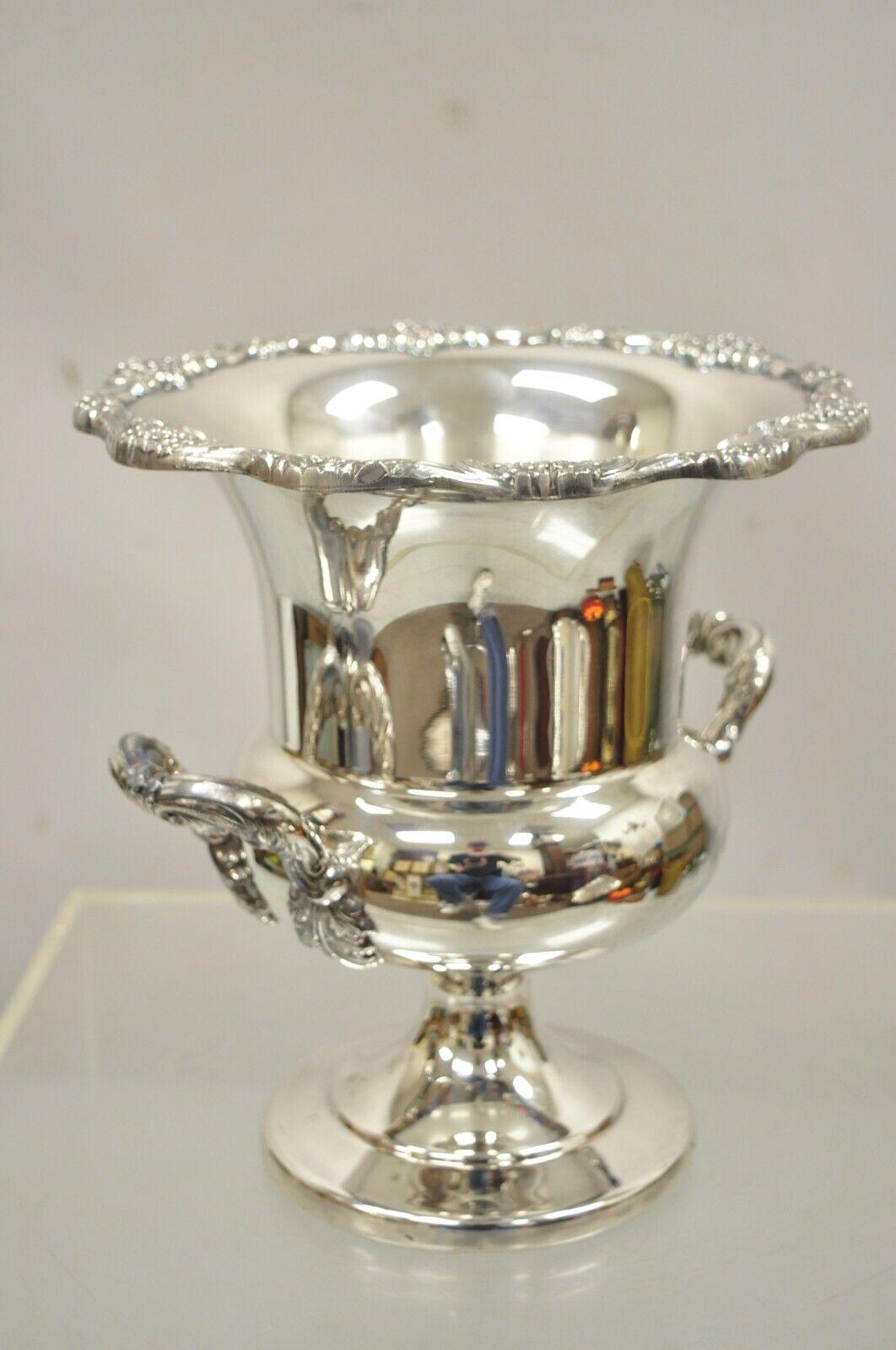 Vintage Regency style heavy silver plate twin handle trophy cup urn champagne chiller ice bucket. Item features ornate twin handles, nice heavy weight, fluted top, very nice vintage item, great style and form. mid 20th century. Measurements: 10.5