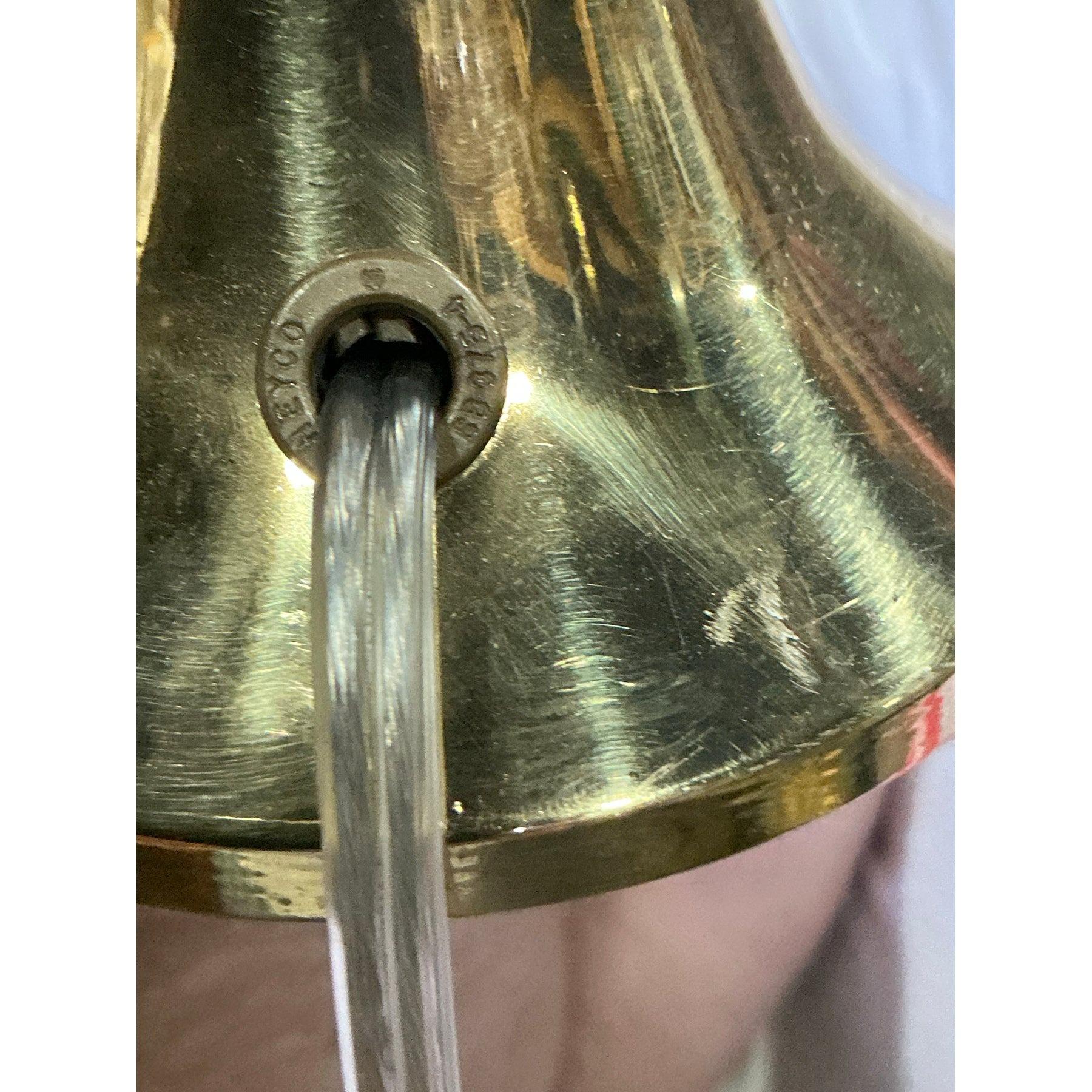 Add a touch of timeless elegance to your decor with this exquisite pair of vintage Regency-style brass bird lamps. Each lamp features a beautifully sculpted brass bird perched on a sleek, flared column base, creating a striking balance of