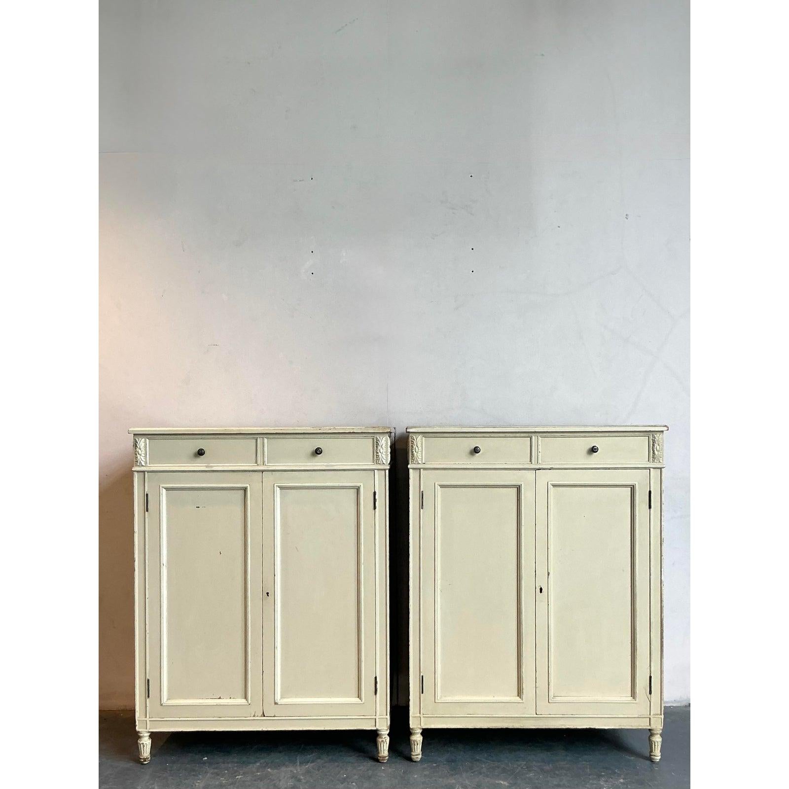 Presenting a stunning pair of Vintage Regency Irving and Casson Davenport cabinets, these pieces embody a timeless elegance that can transform any space. Crafted from wood and finished in a classic painted style, these cabinets showcase the refined